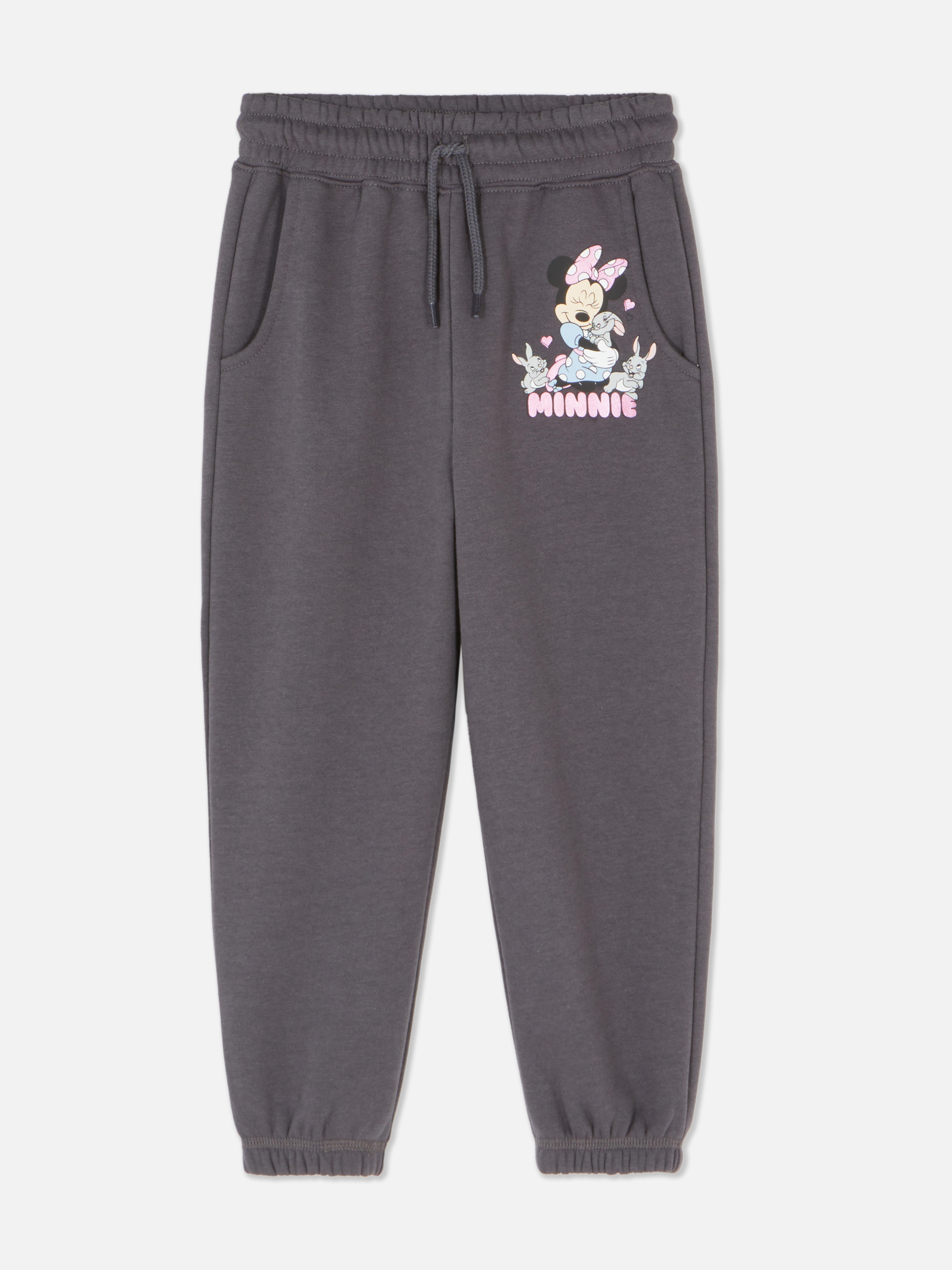 Pantaloni de trening asortați cu Minnie Mouse de la Disney. Pantaloni de trening cu șnur de strângere, manșete la gleznă și imprimeu cu Minnie Mouse îmbrățișând un iepuraș.