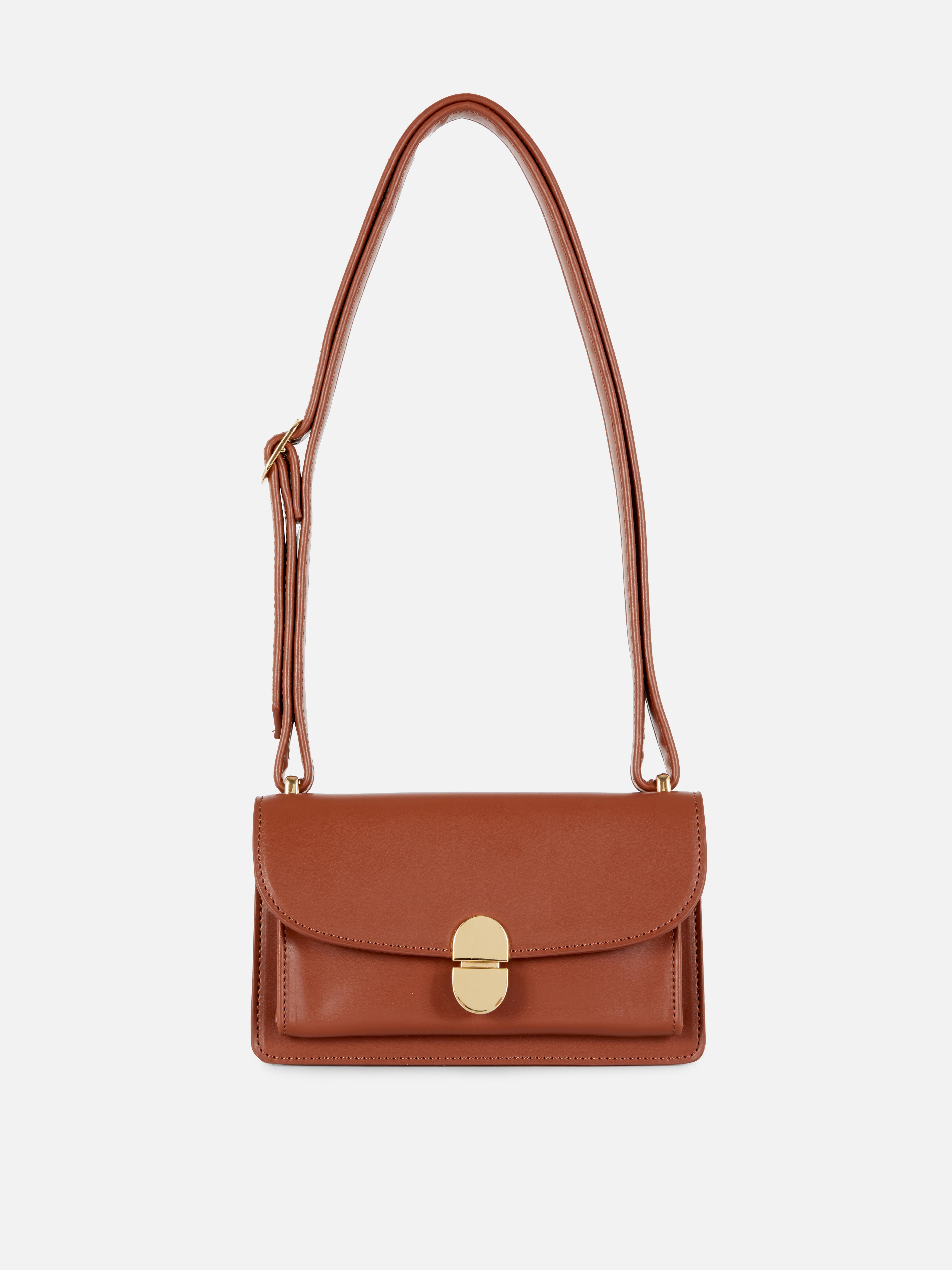 Schultertasche mit Verschluss. Genießen Sie den dezenten Luxus-Look dieser Tasche aus Kunstleder.