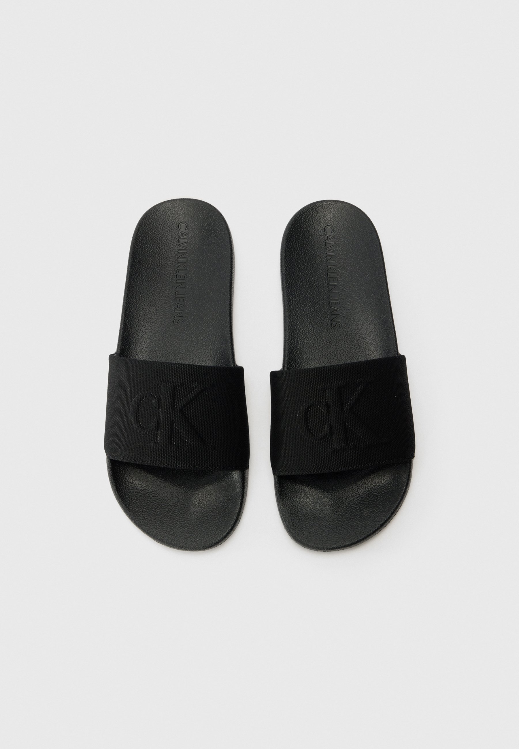 Calvin Klein Jeans SLIDE MONO - Nazouvací boty - black