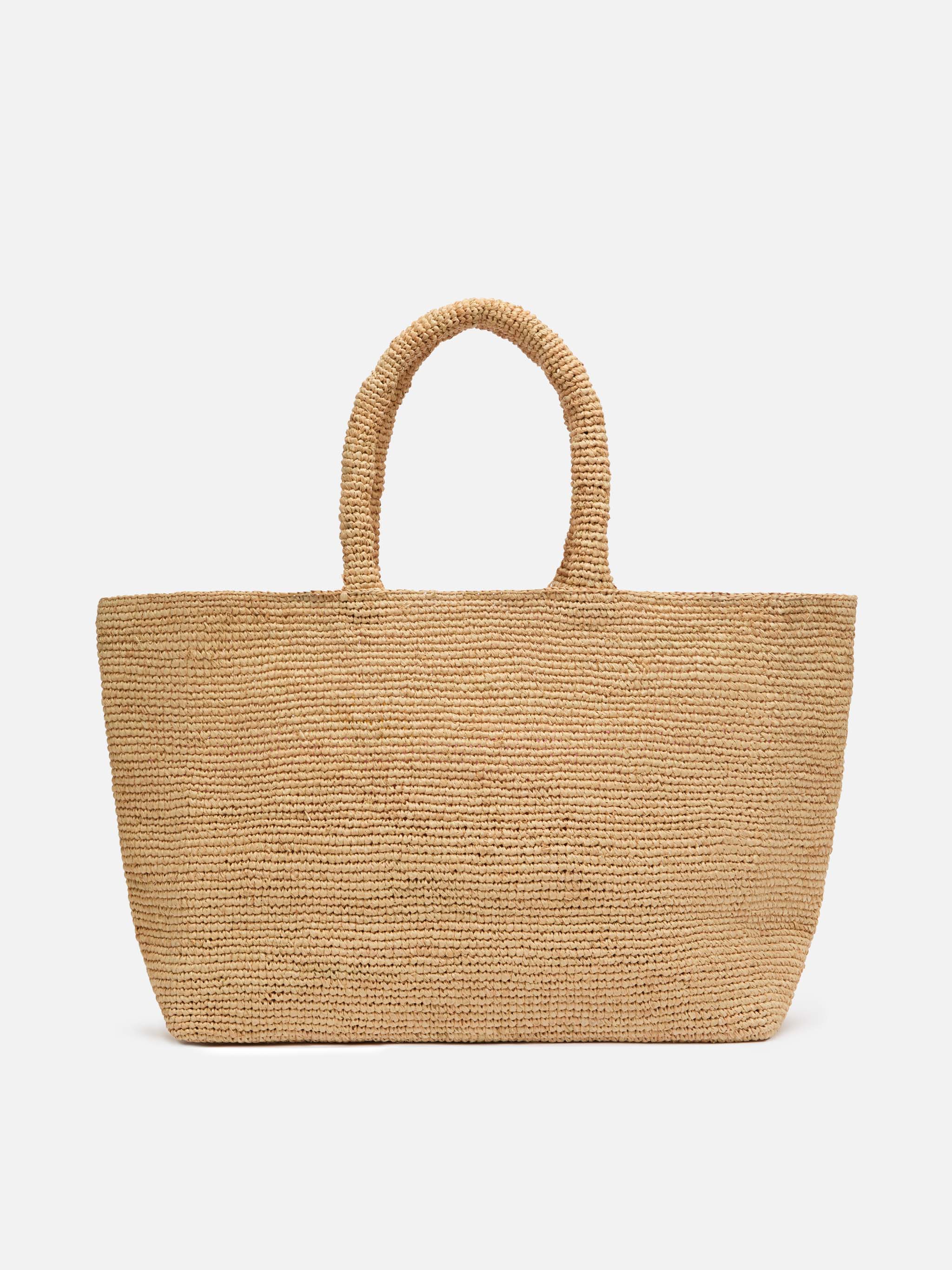 Beige raffia strandtas met katoenen binnenvak en Ibiza-borduurwerk.