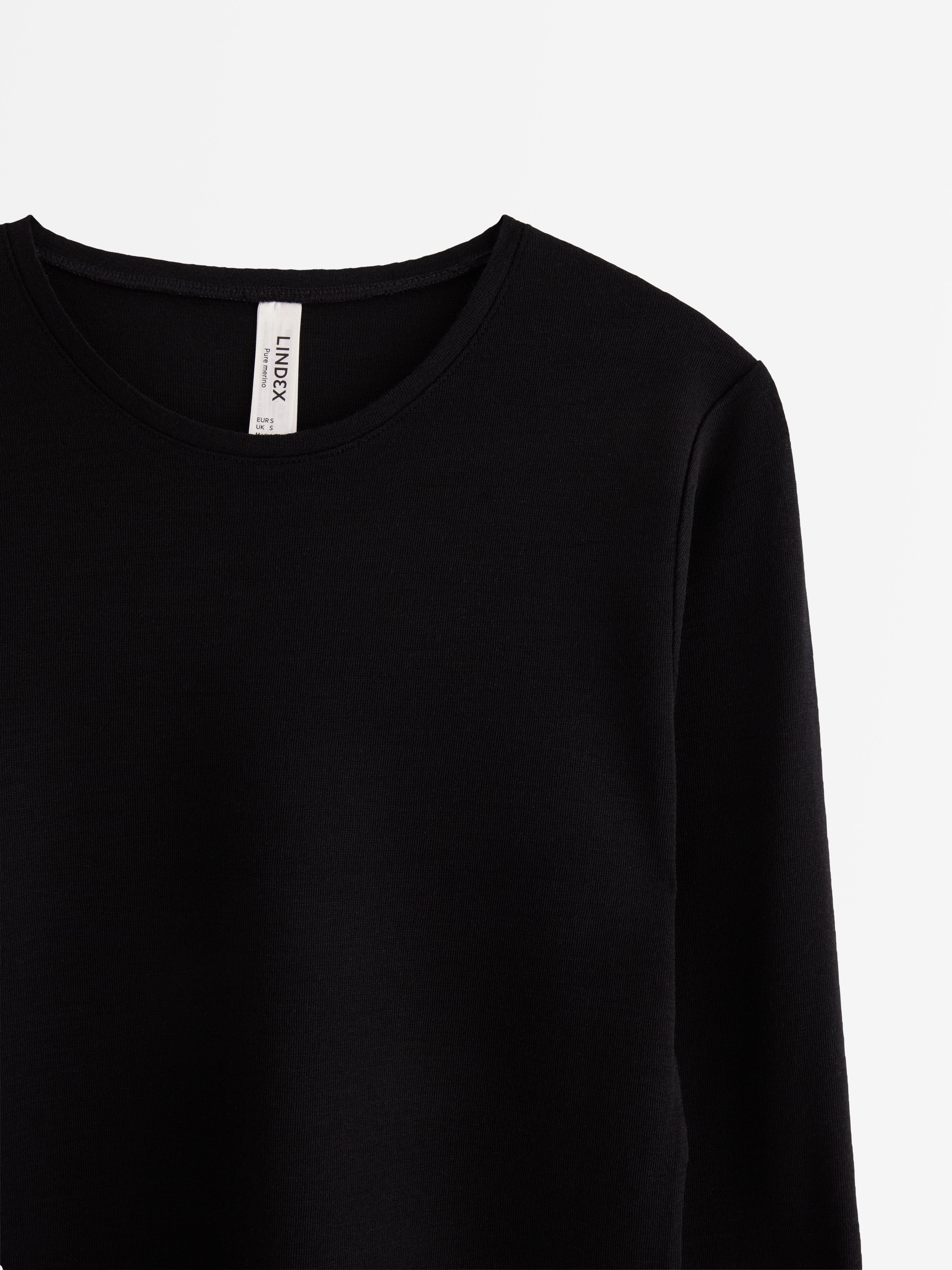 Top de manga larga de lana merino negro