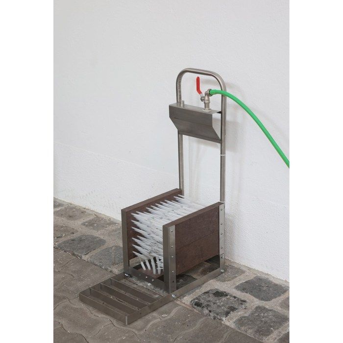Kit de arandelas para botas desmontado en una caja Kerbl.