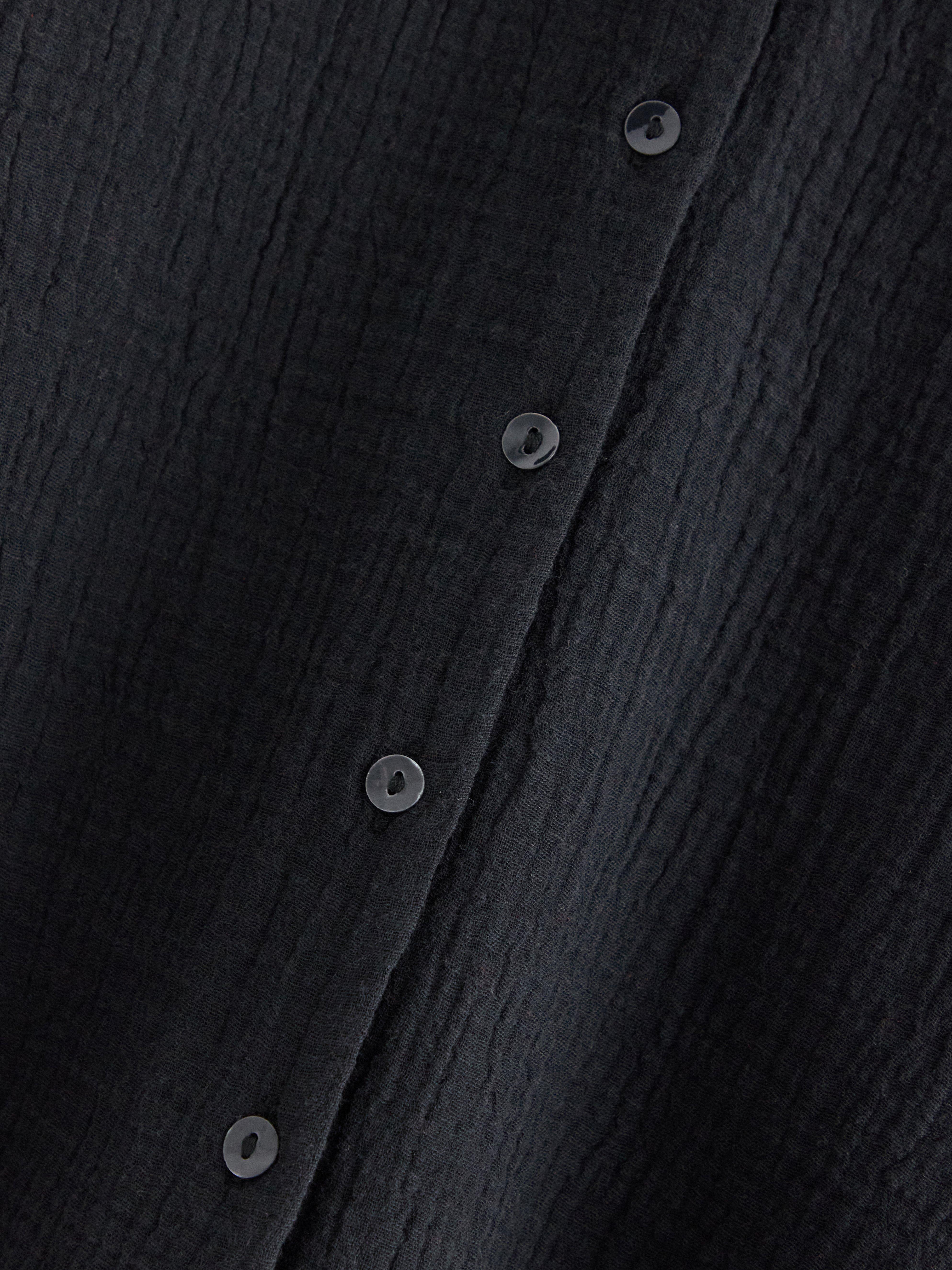 Camisa arrugada de mamá negra