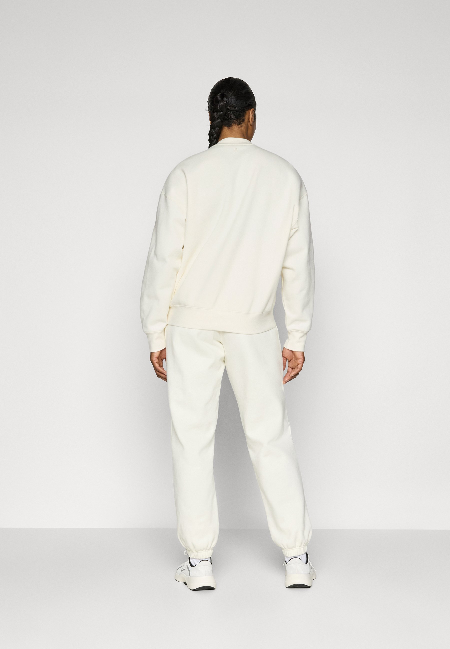 Pantaloni della tuta Björn Borg STUDIO - Tracksuit bottoms - cannoli cream
