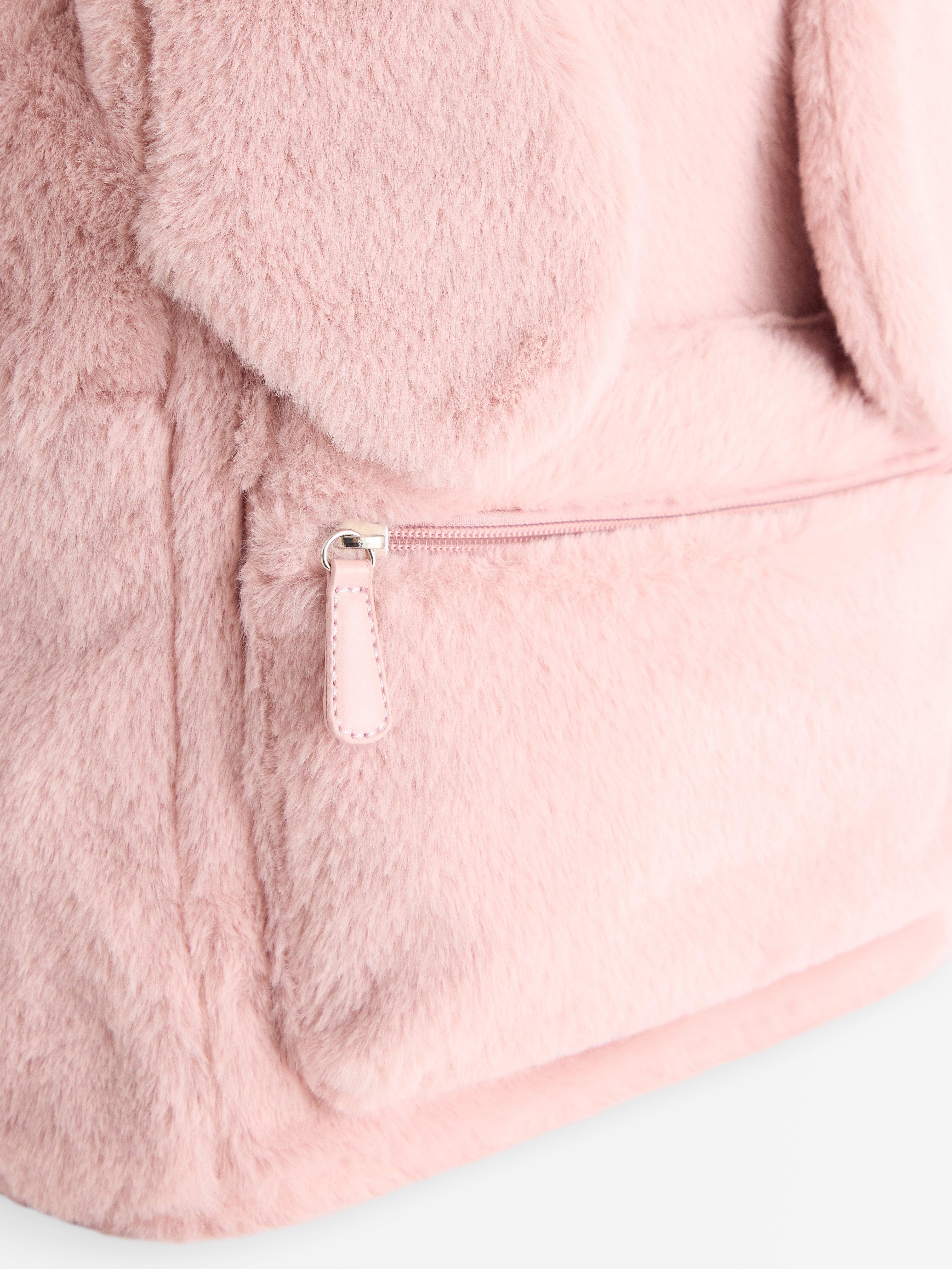 Sac à dos en fausse fourrure rose poudré