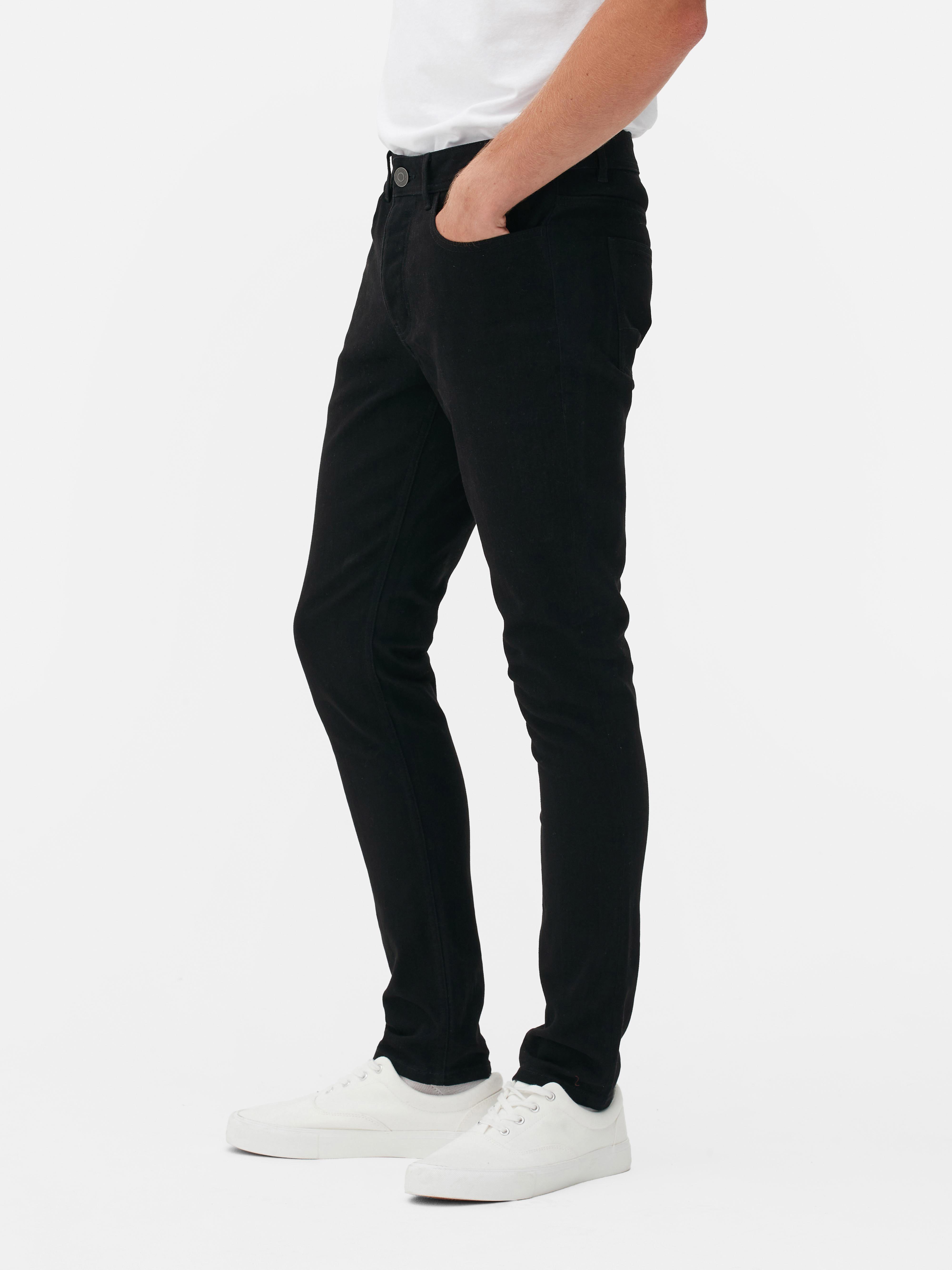 Pantaloni skinny din bumbac twill. Acești pantaloni skinny din bumbac twill prezintă elemente clasice, precum cinci buzunare și găici pentru curea.