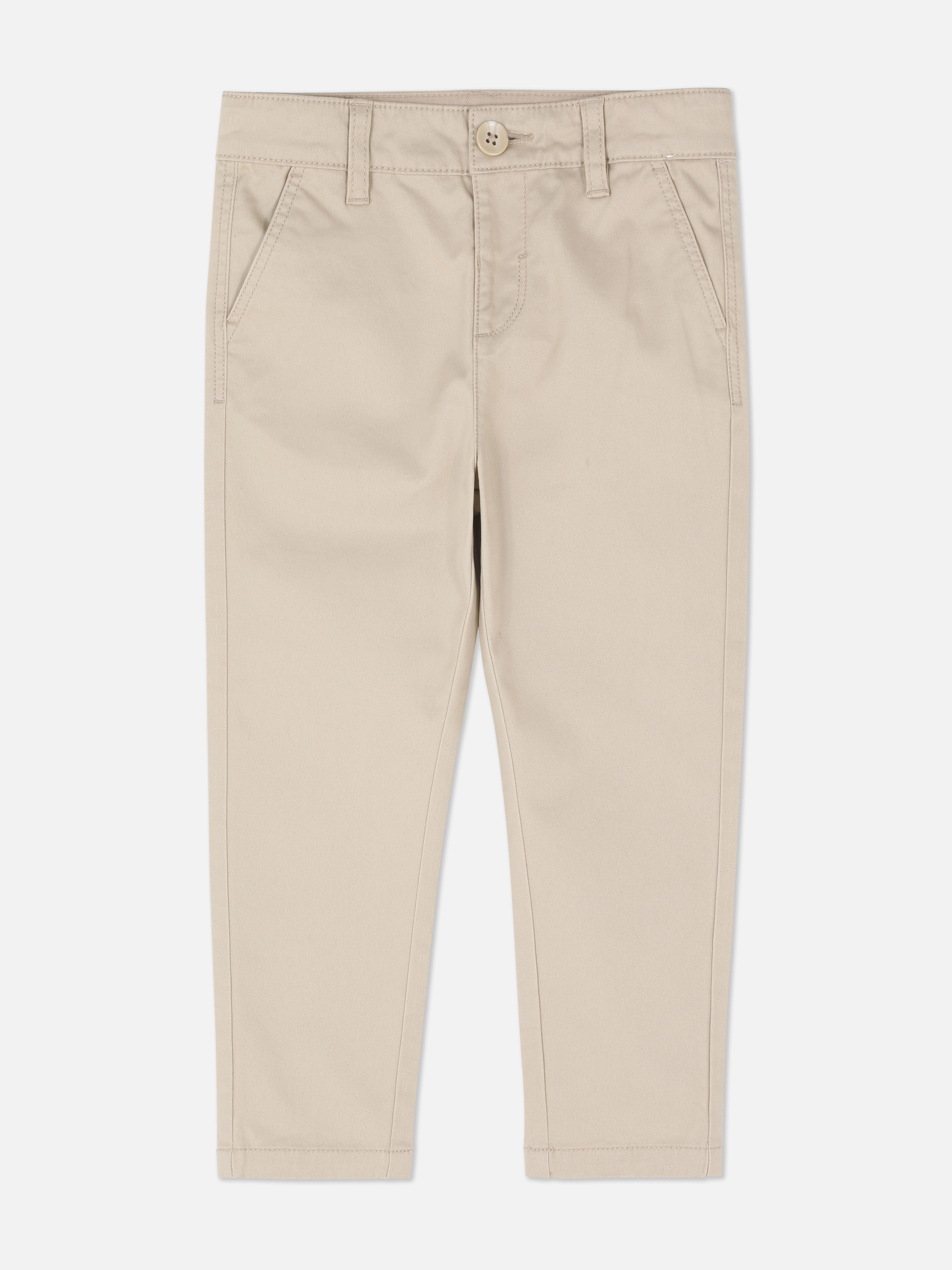 Chino nadrág fiúknak. Ezek az övbújtatókkal, zsebrészletekkel és egyenes szárral ellátott chino nadrágok a fiúk elegáns ruhatárának részét képezik.