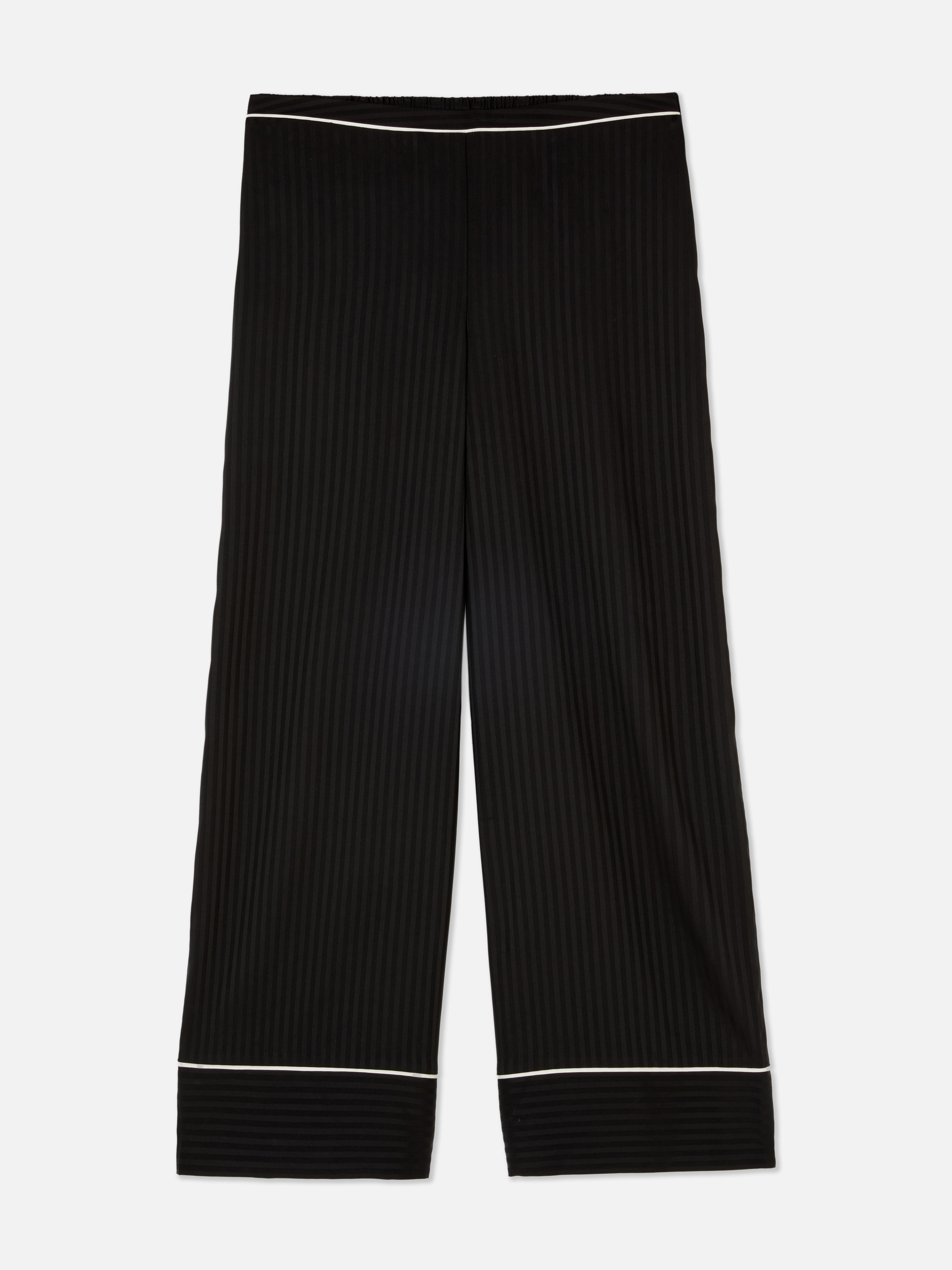 Pantaloni de pijama asortați cu garnitură contrastantă. Pantaloni de pijama cu croială largă și garnitură contrastantă.
