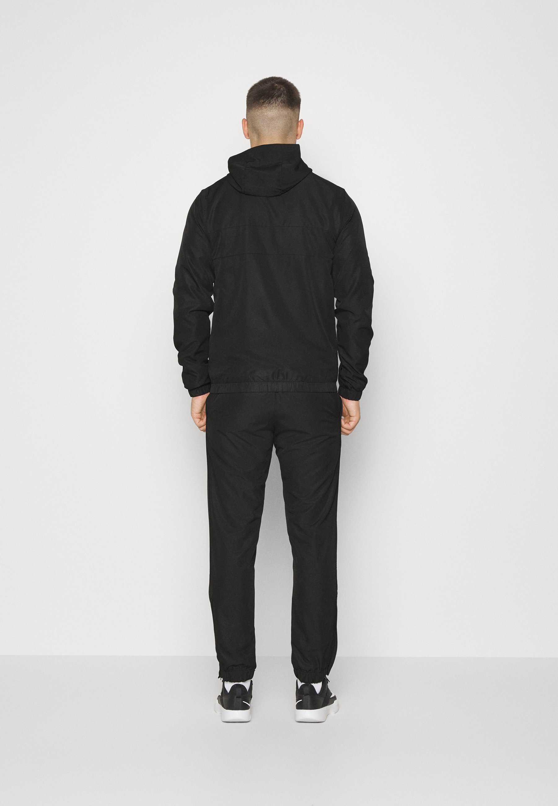 Tuta sportiva Lacoste con cappuccio - nera