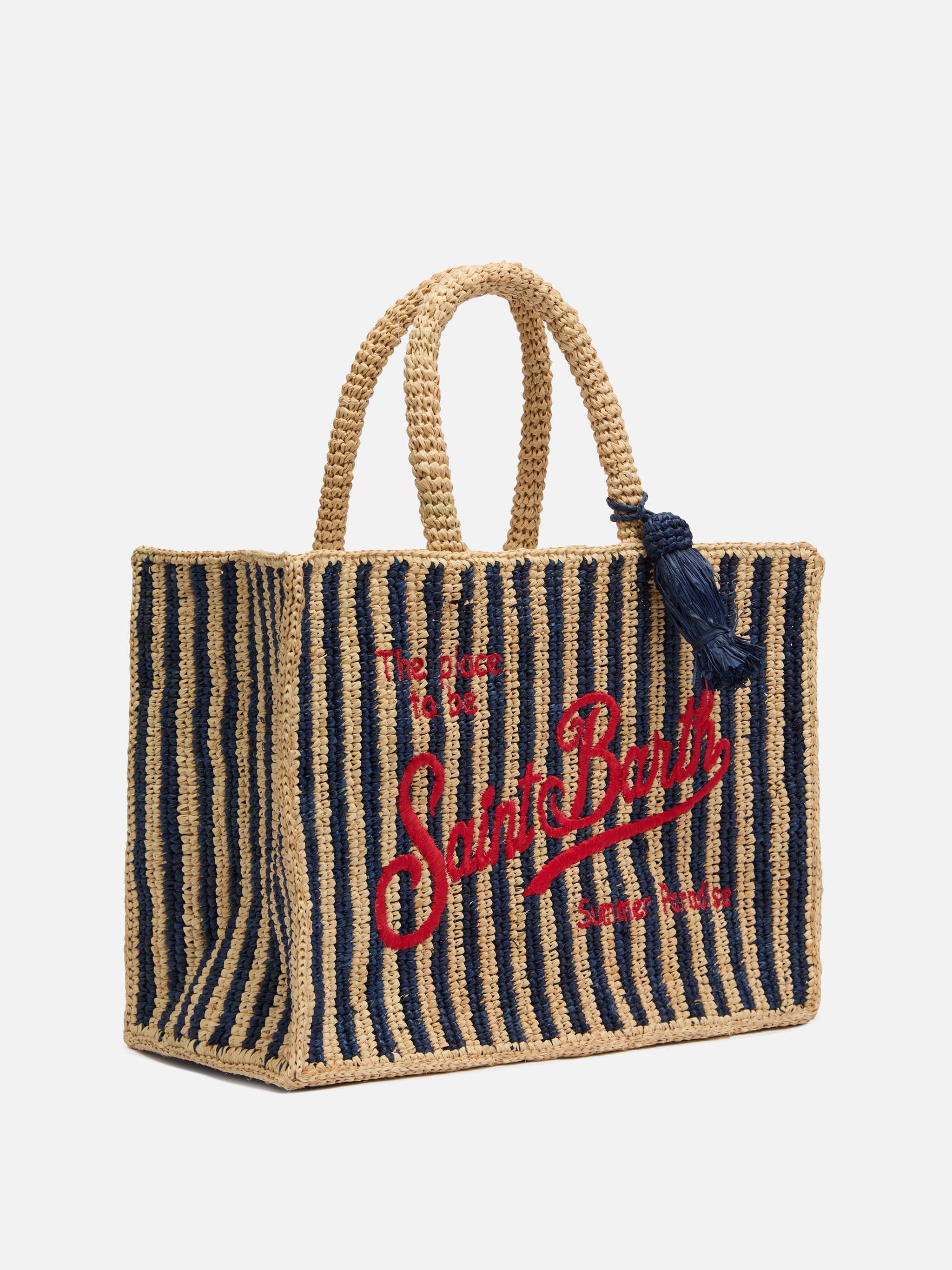 Colette-tas van marineblauwe gestreepte raffia met geborduurd logo.