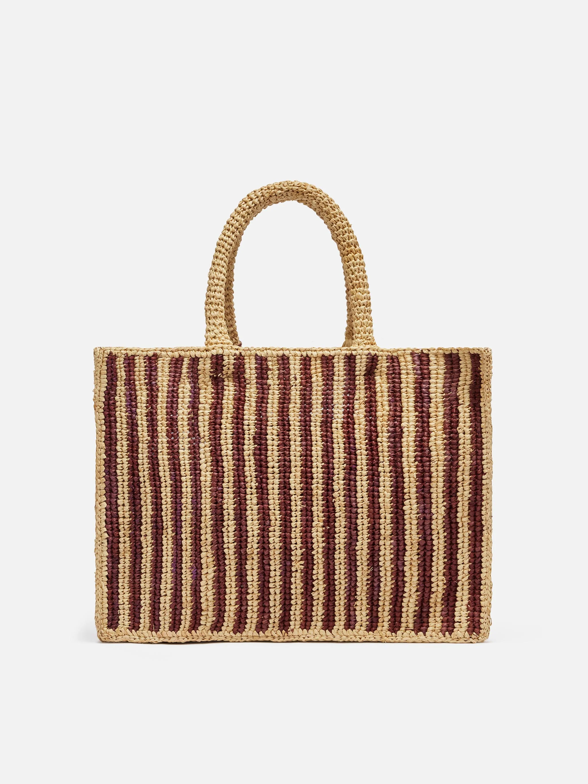 Colette tas van bruin gestreept raffia met geborduurd logo.