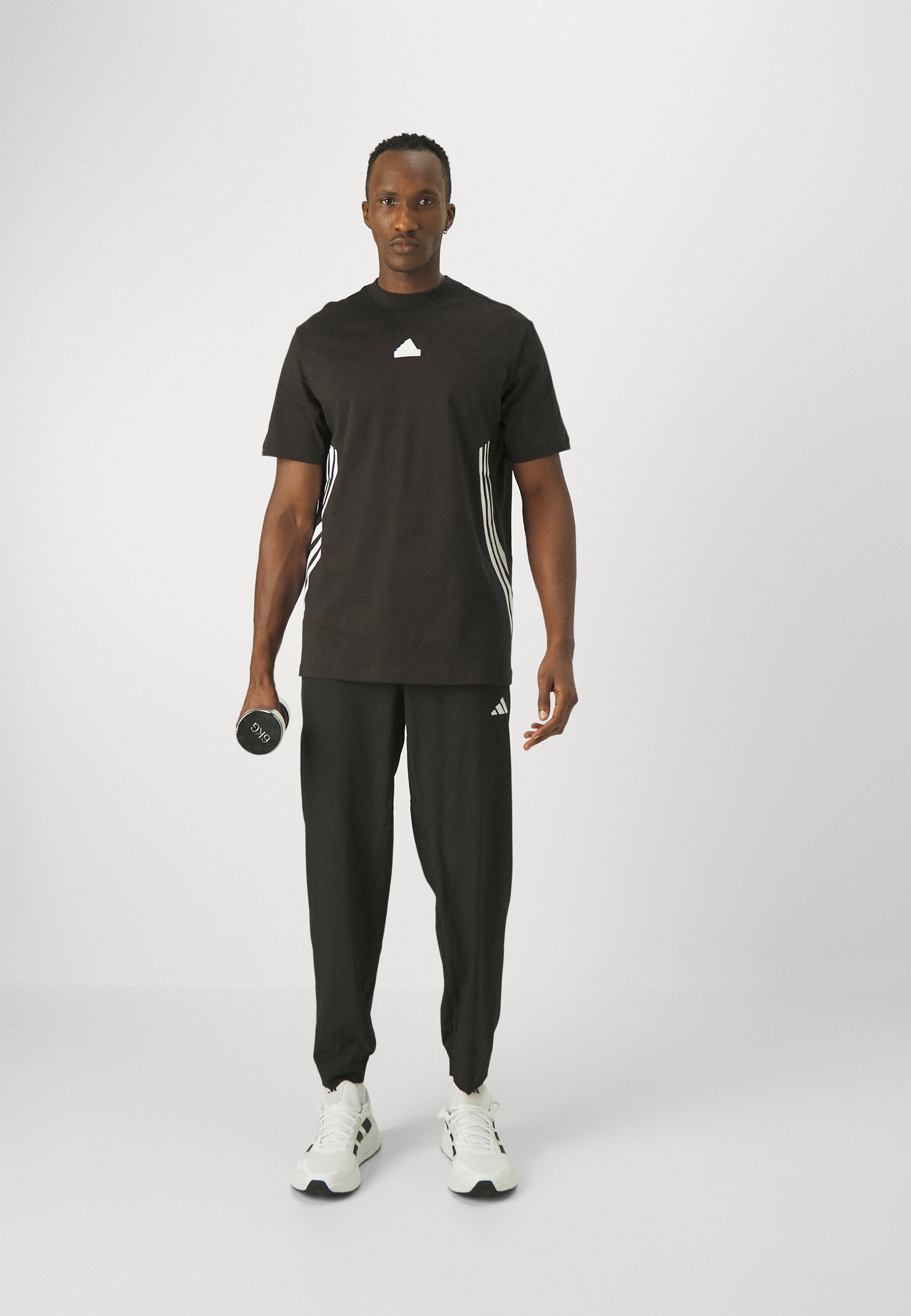 Pantaloni da allenamento adidas Performance TRAIN ESSENTIALS - Pantaloni della tuta - nero/bianco