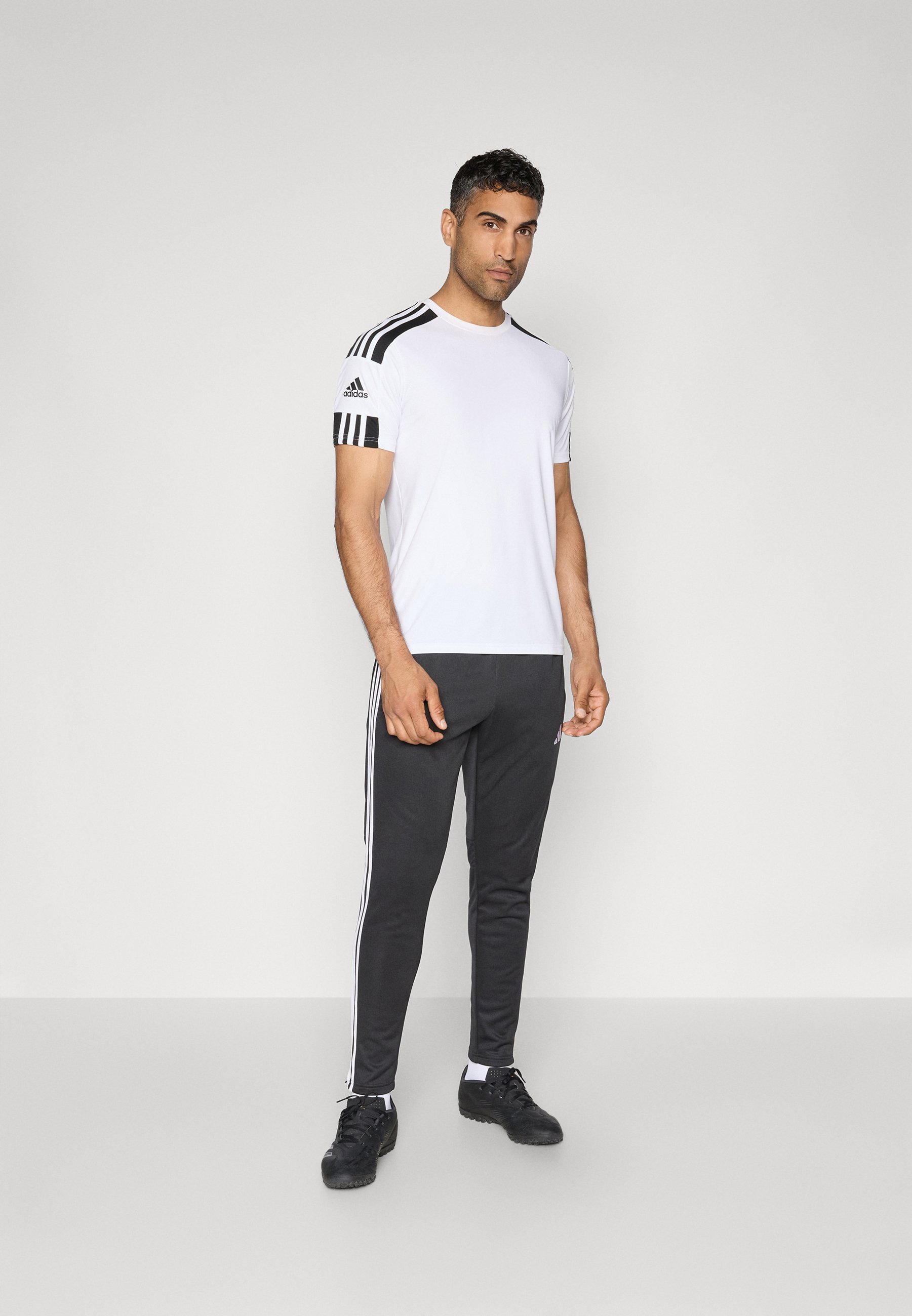 Pantaloni da allenamento invernali adidas Performance TIRO25 ESSENTIALS - Pantaloni della tuta - nero/bianco