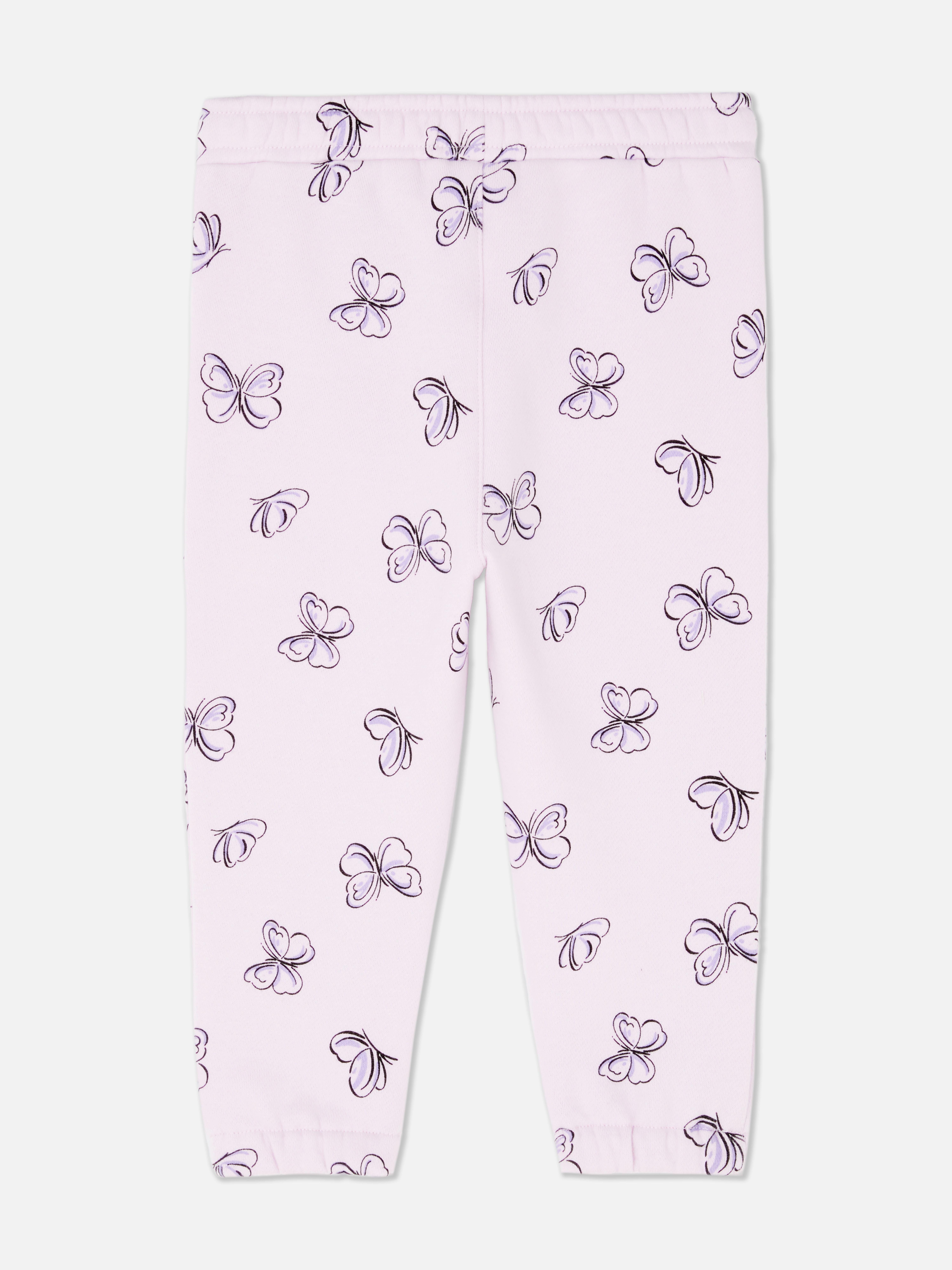 Pantaloni de trening asortați cu talie elastică și șnur de strângere. Acești pantaloni de trening drăguți au manșete la gleznă și sunt extrem de confortabili.