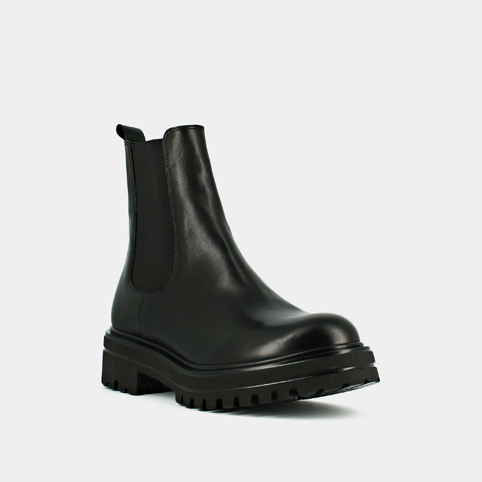 Boots à semelles crantées et élastiques  en cuir noir