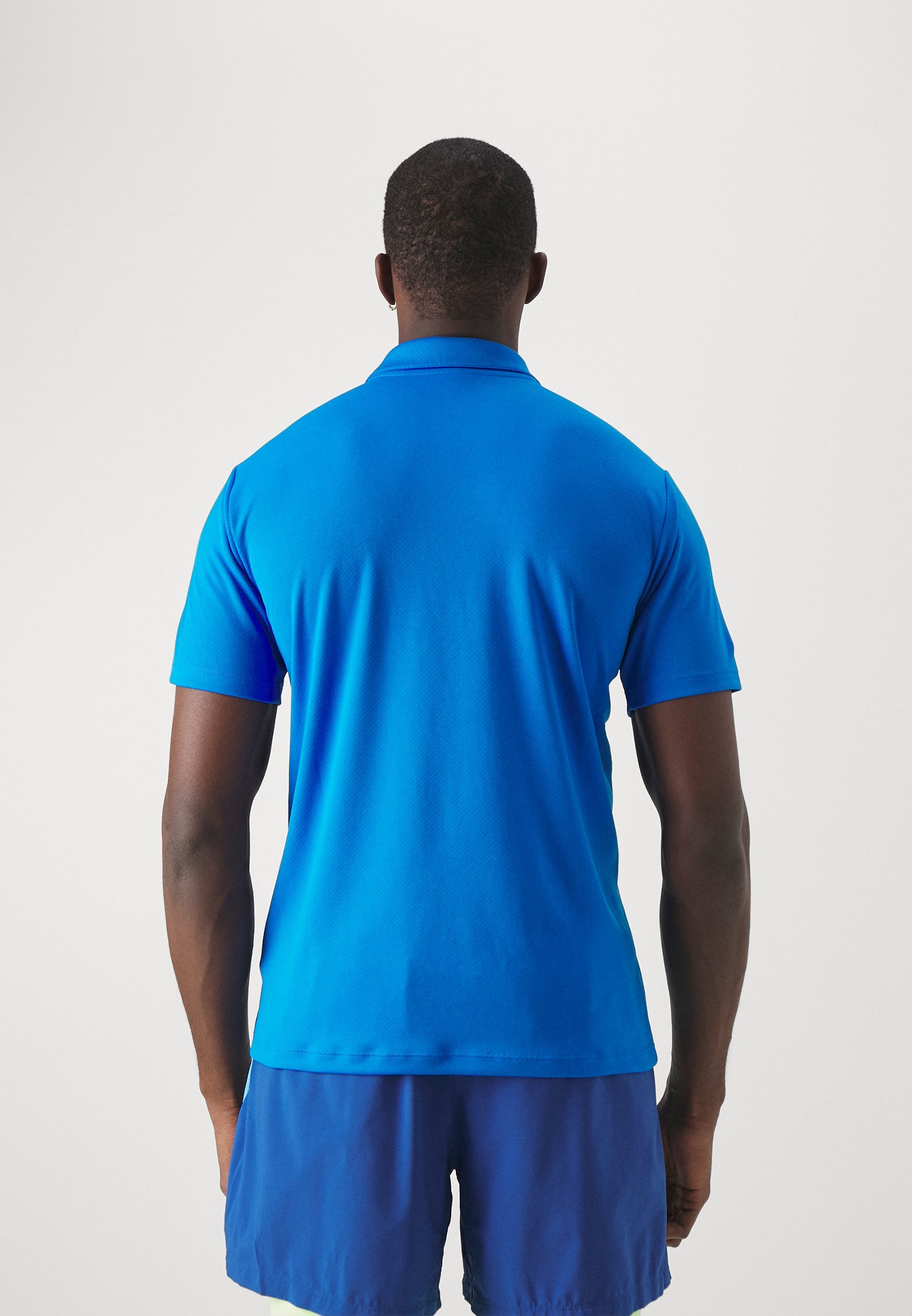 Puma TEAMGOAL - Pikeepaita - electric blue lemonade/valkoinen/team royal