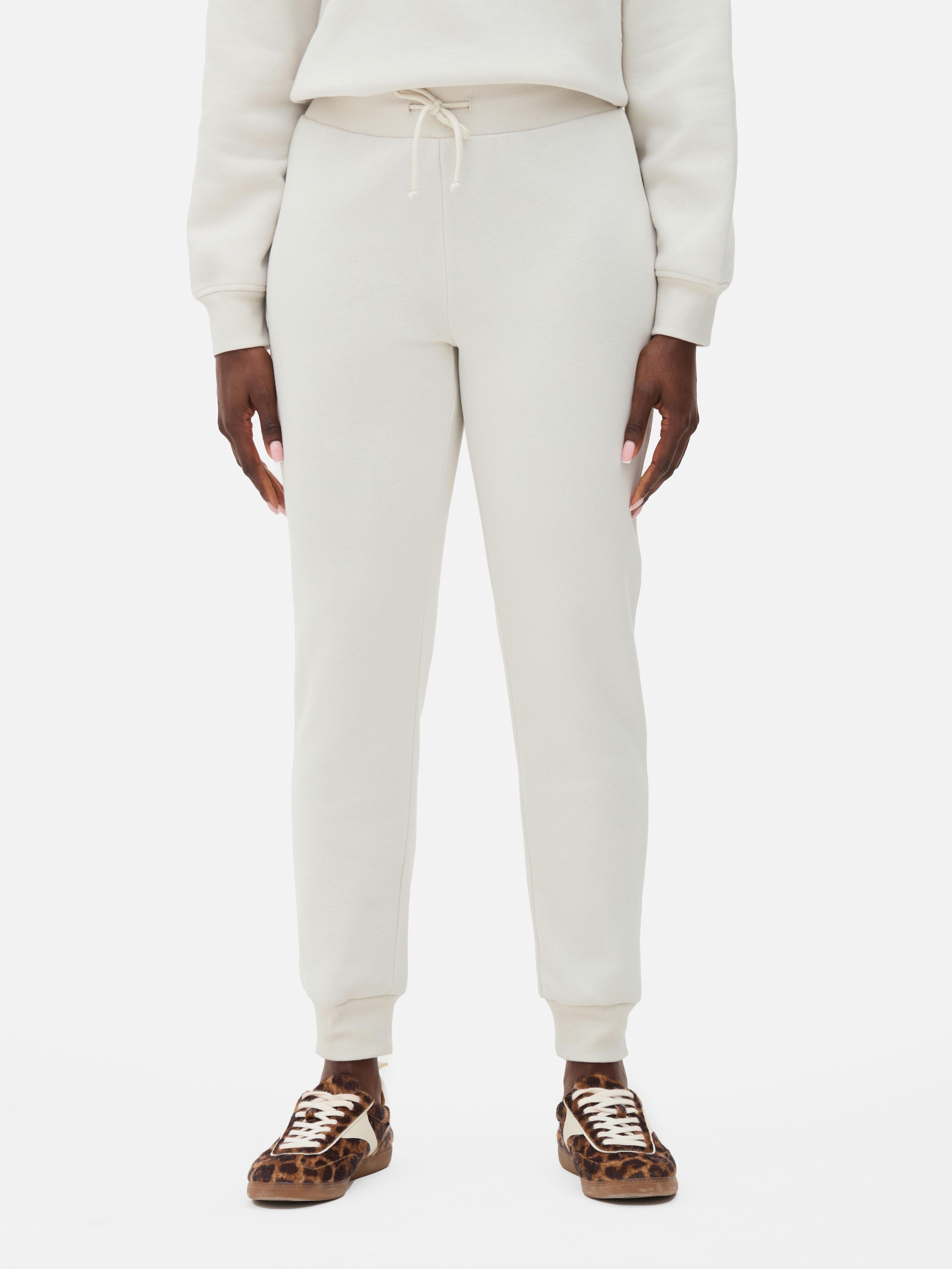 Pantaloni de trening skinny Acești pantaloni de trening slim fit cu manșete la gleznă creează un aspect elegant pentru momente elegante și zile active.