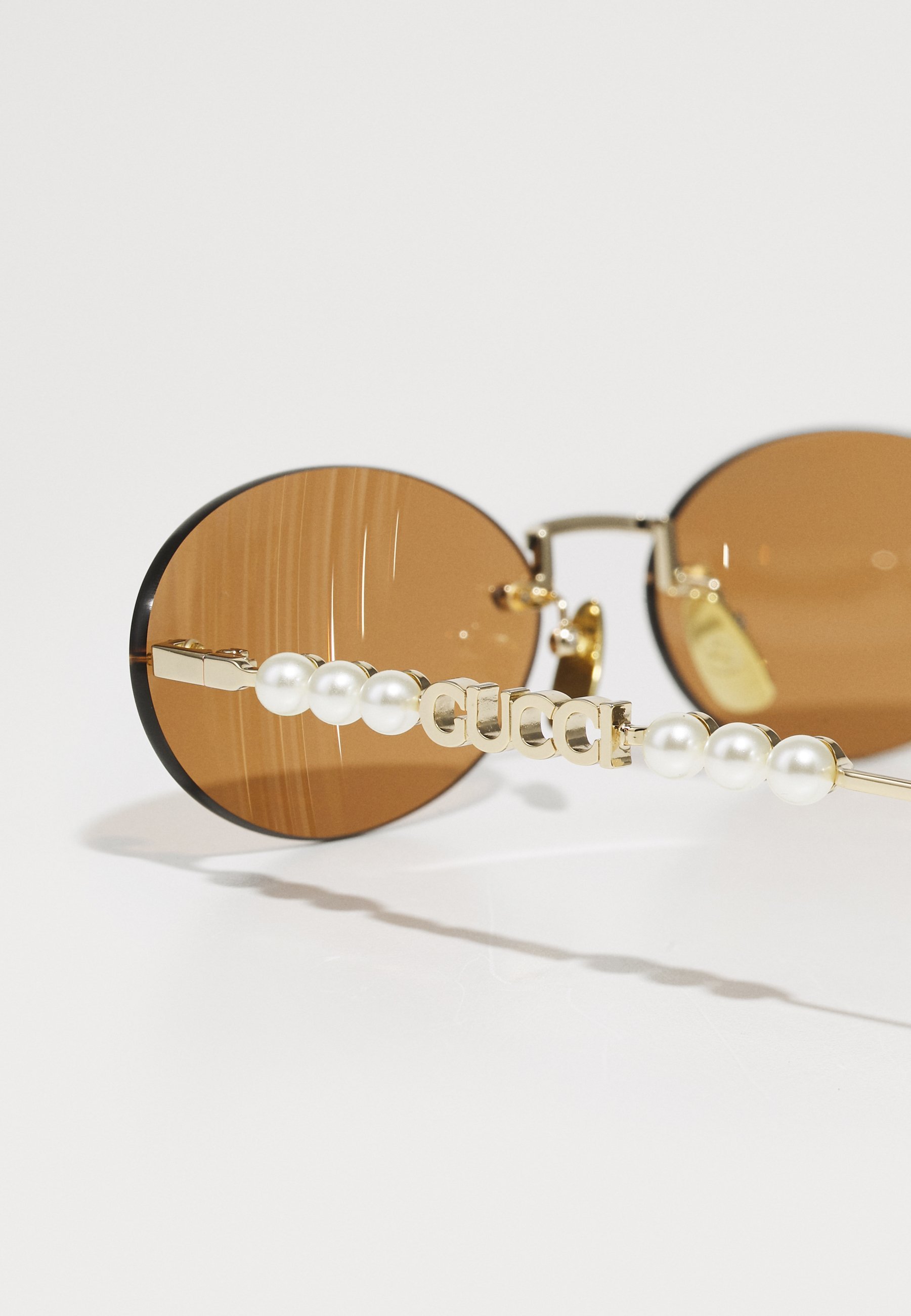 Lunettes de soleil Gucci - couleur or/marron