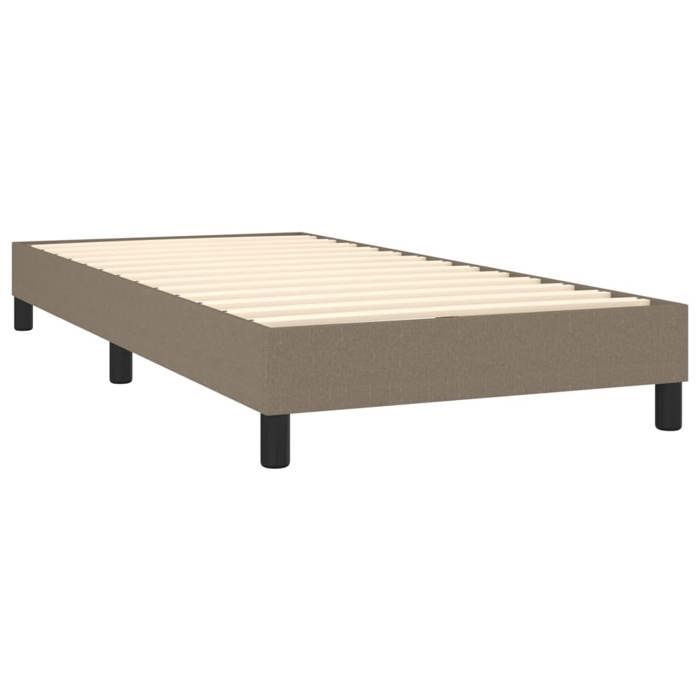 Preciosa estructura de cama individual con somier de láminas, para adultos, tapizada en tela color topo de 90x190 cm, año 1991.
