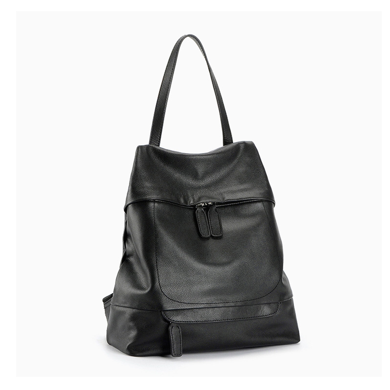 Sac à dos en cuir véritable noir pour femme, style tendance, avec fermeture éclair et bandoulière pratique. Idéal pour l'école et les sorties au quotidien.