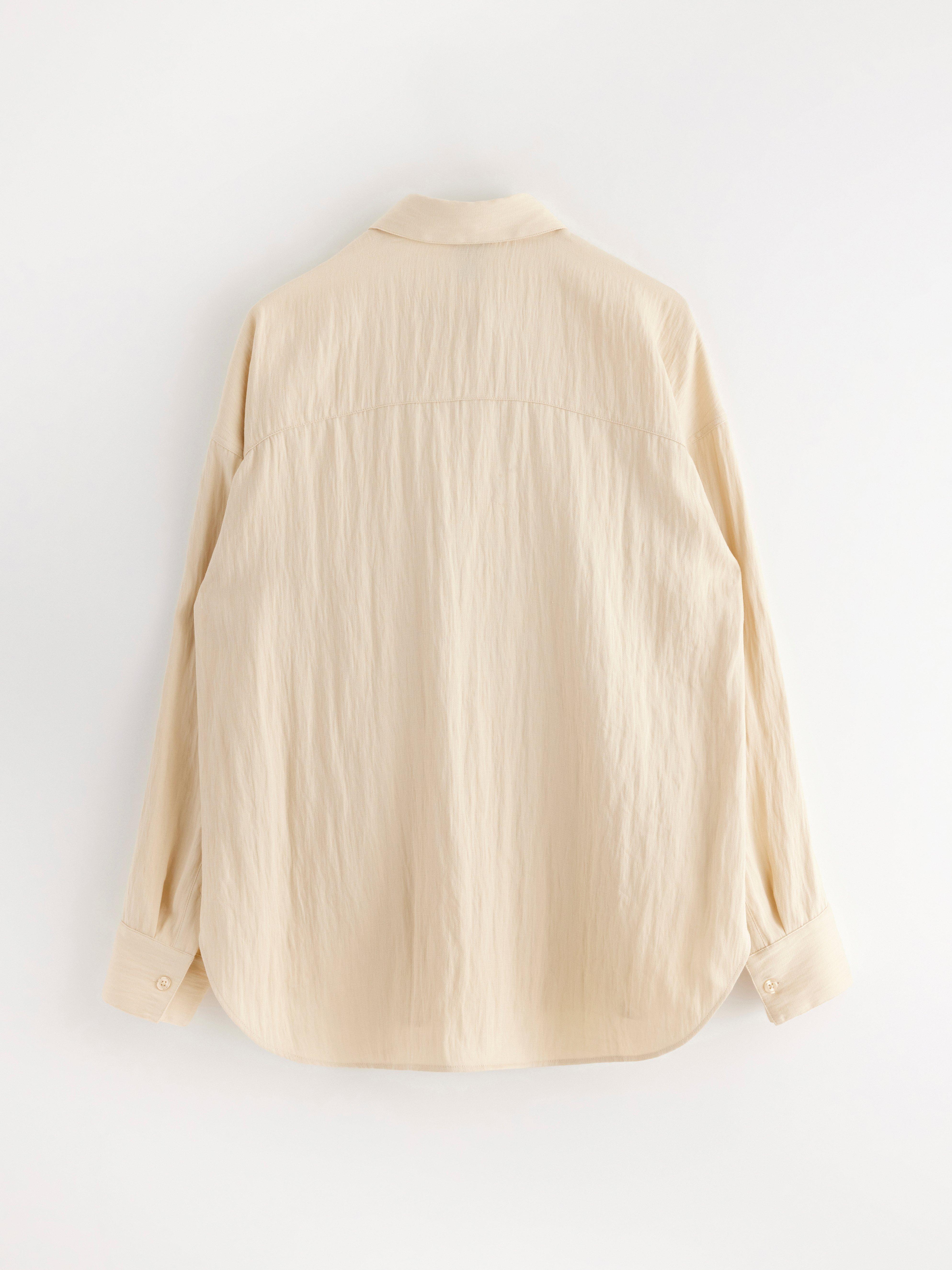 Camisa de manga larga color beige claro