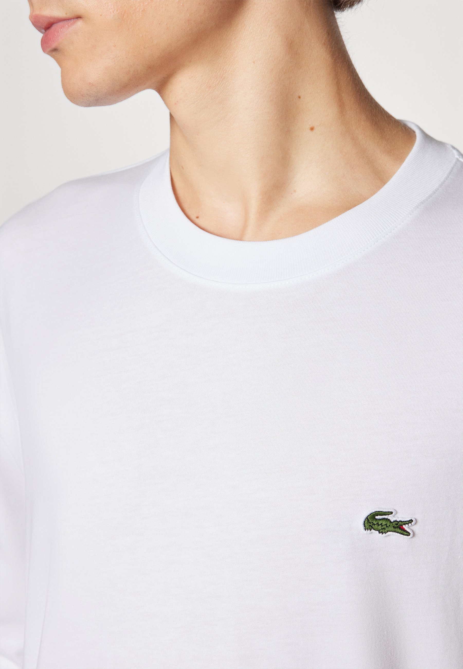 Top s dlouhým rukávem Lacoste - bílý