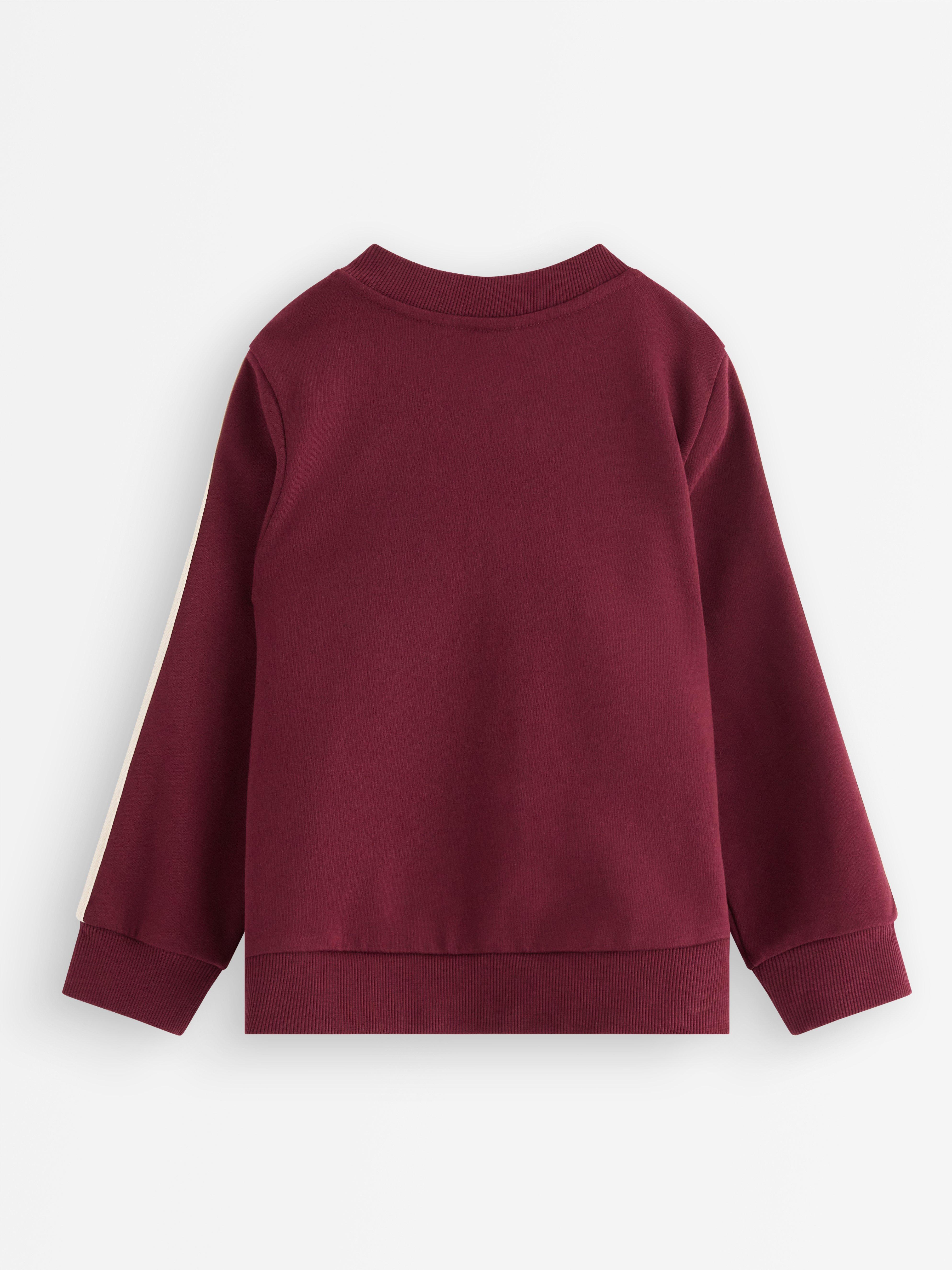 Sudadera con cremallera, color rojo oscuro empolvado.