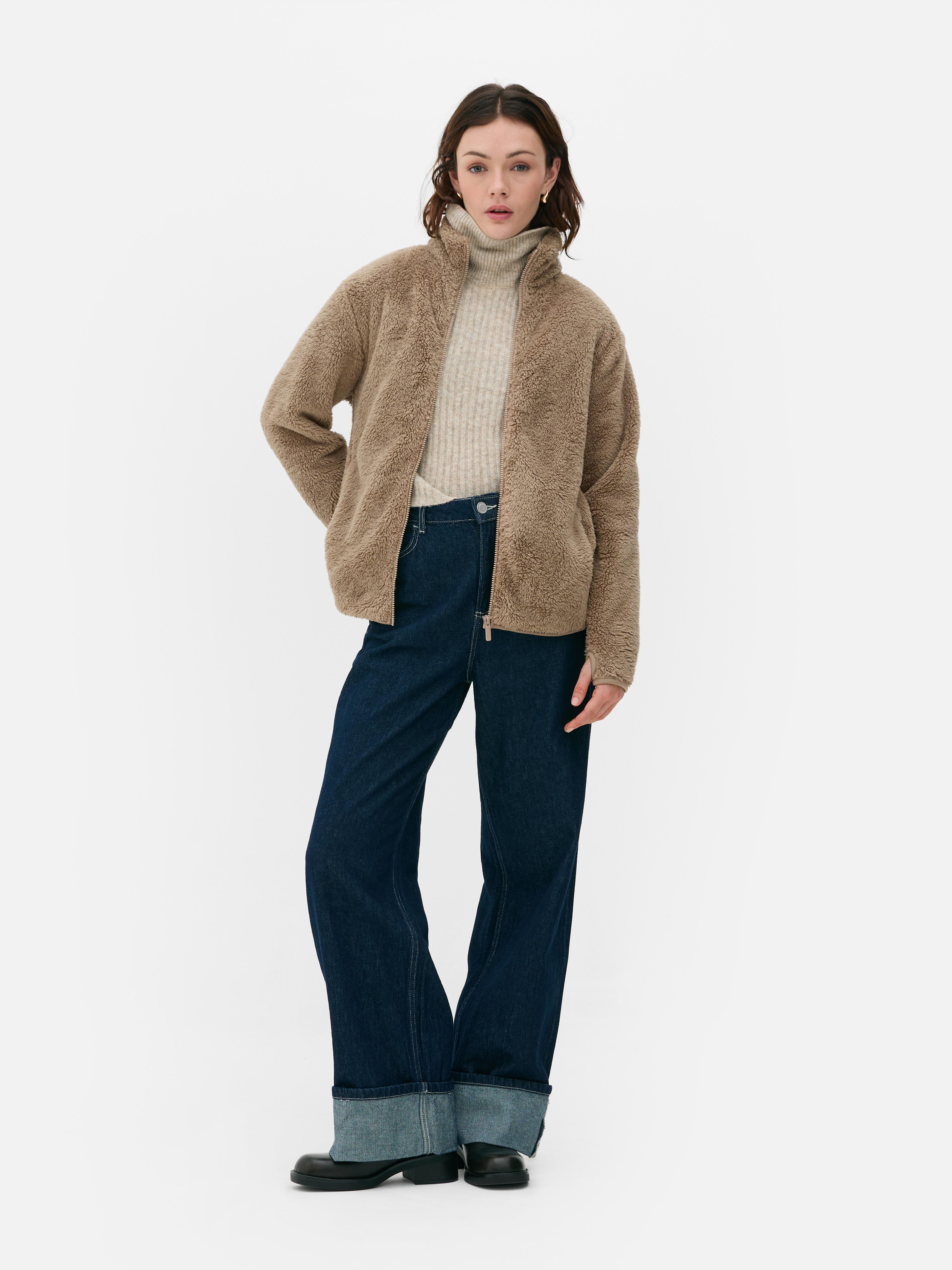 Teddy fleece zippered jacket. A soft teddy fleece jacket with long sleeves, a stand-up collar, and a full-length zipper.