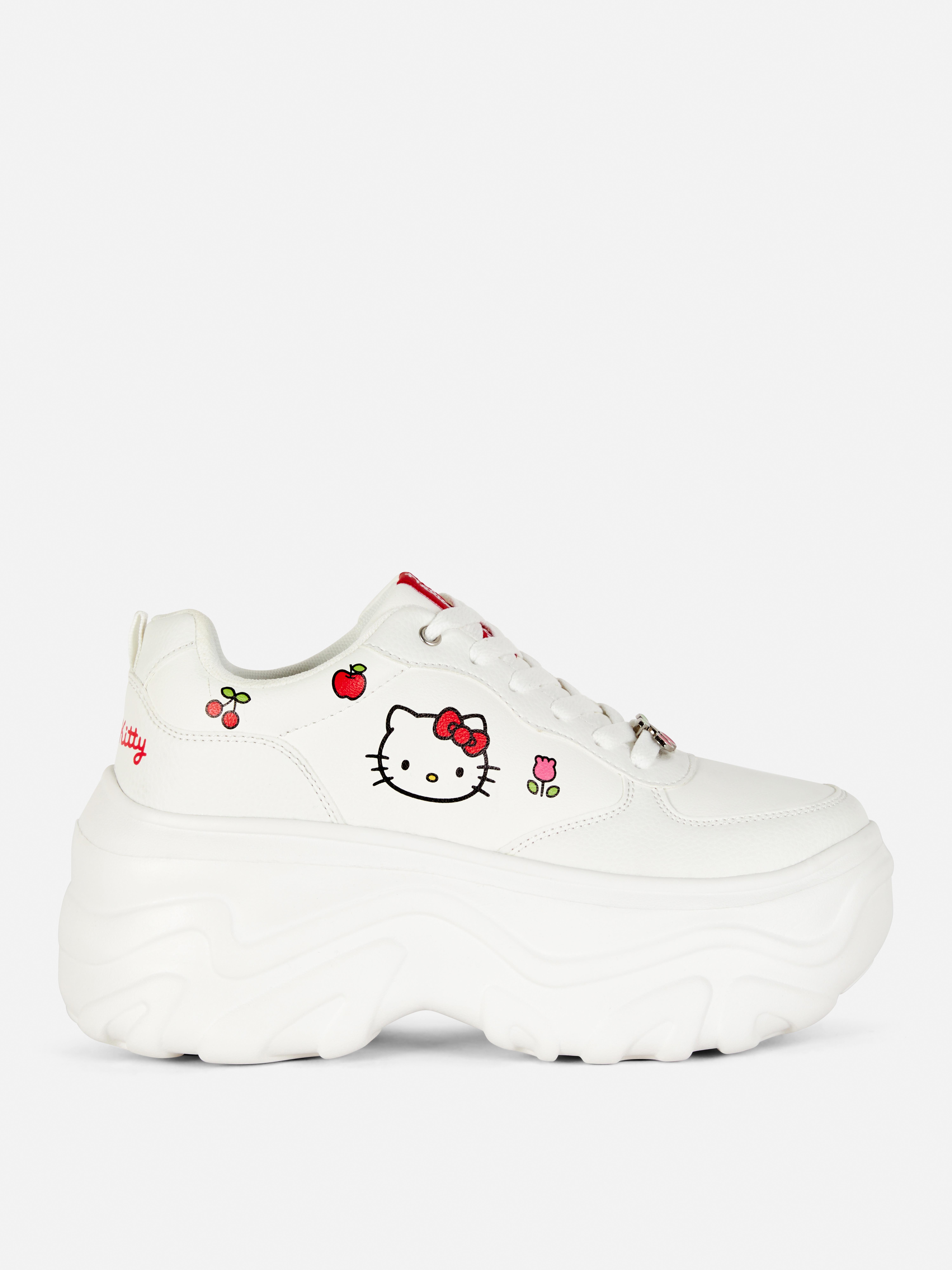 Εξαιρετικά ανθεκτικά αθλητικά παπούτσια Hello Kitty με σόλα πλατφόρμας και στάμπα Hello Kitty με φρούτα και λουλούδια.