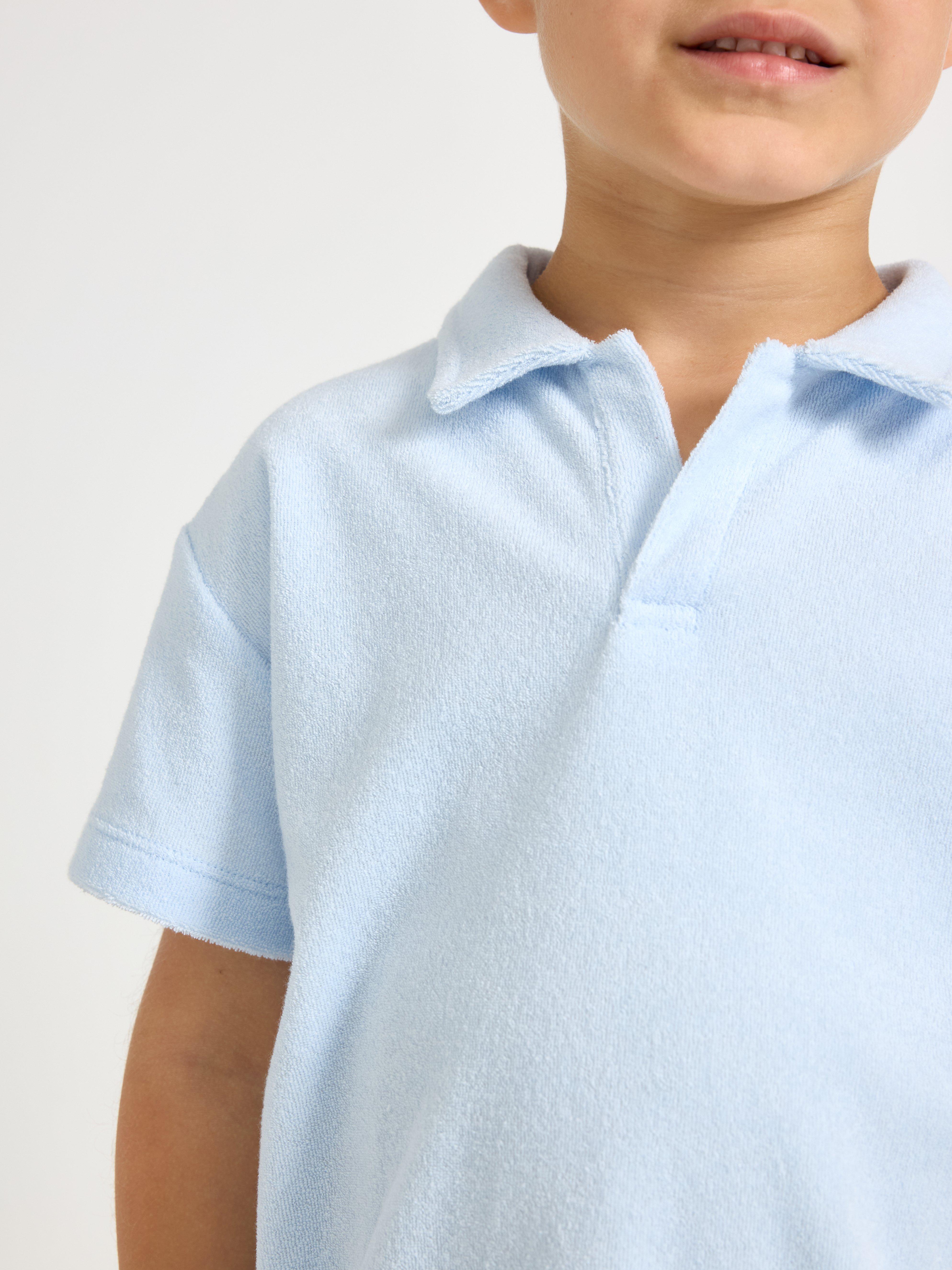 Camisa de manga curta em tecido atoalhado azul claro