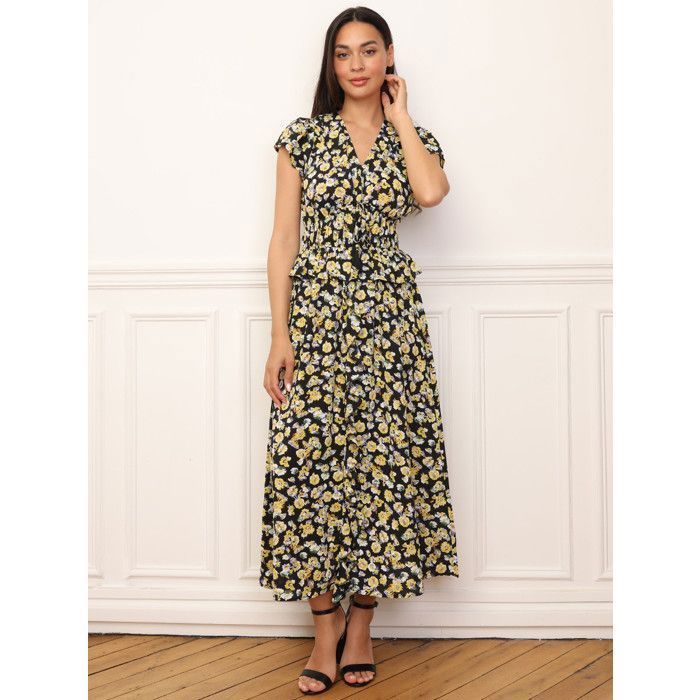 Vestido largo estampado floral con volantes en la parte delantera y en la cintura. Cuenta con dos filas de elástico en la cintura y...
