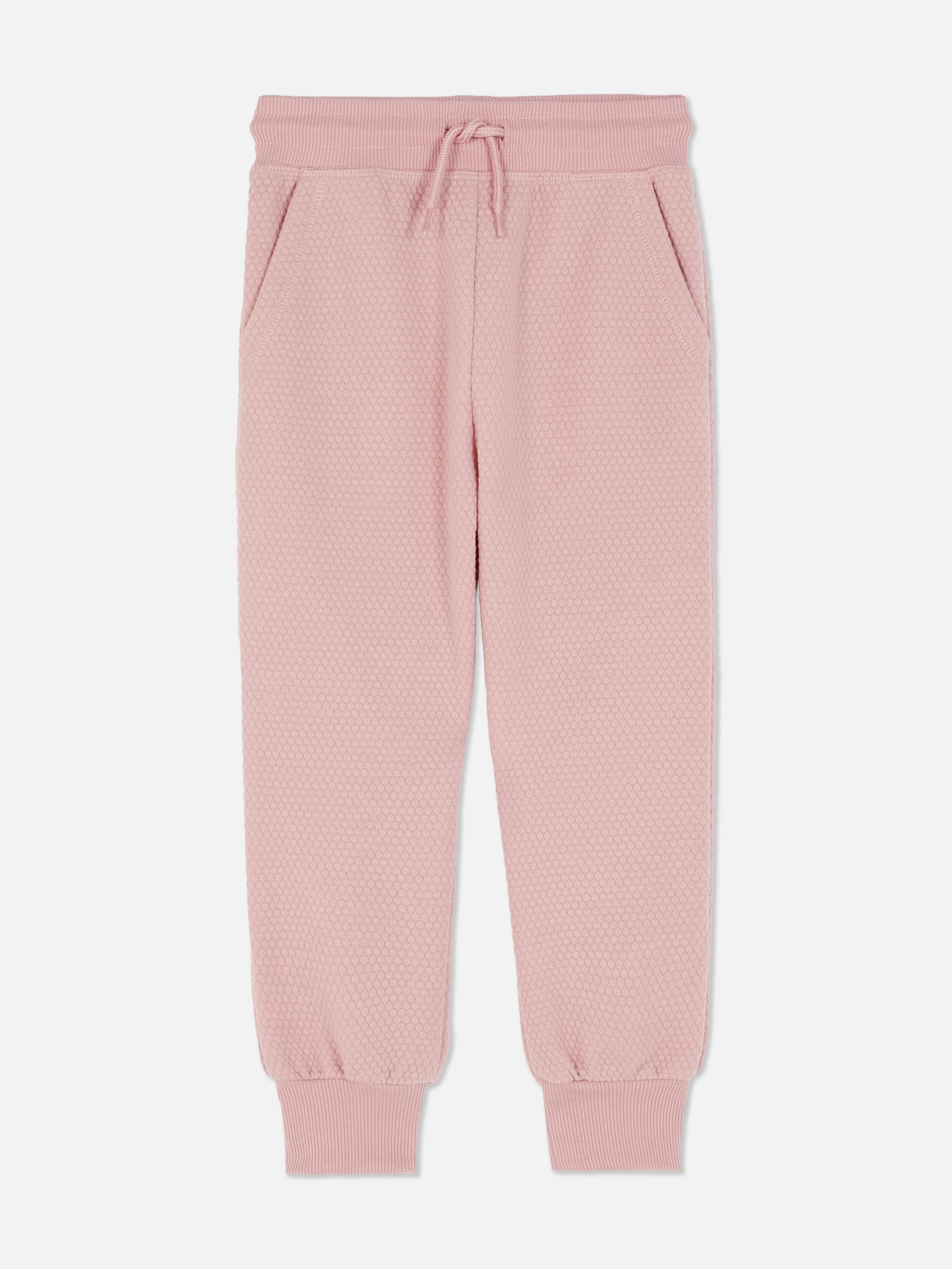 Matchende joggingbroek met trekkoord en wafeltextuur Een joggingbroek van wafelstof met trekkoord, steekzakken en enkelboorden