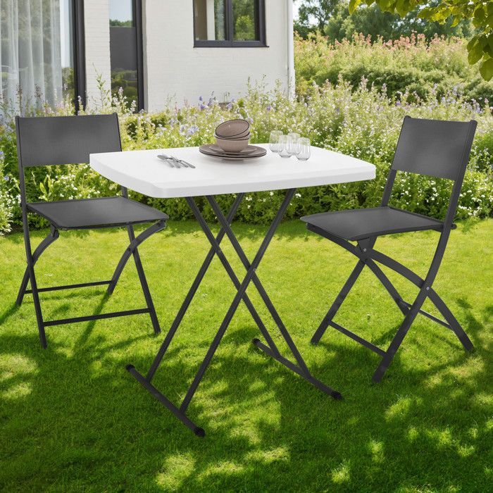 Mesa plegable IDMARKET con 3 posiciones de altura ajustables para camping en interiores y exteriores.