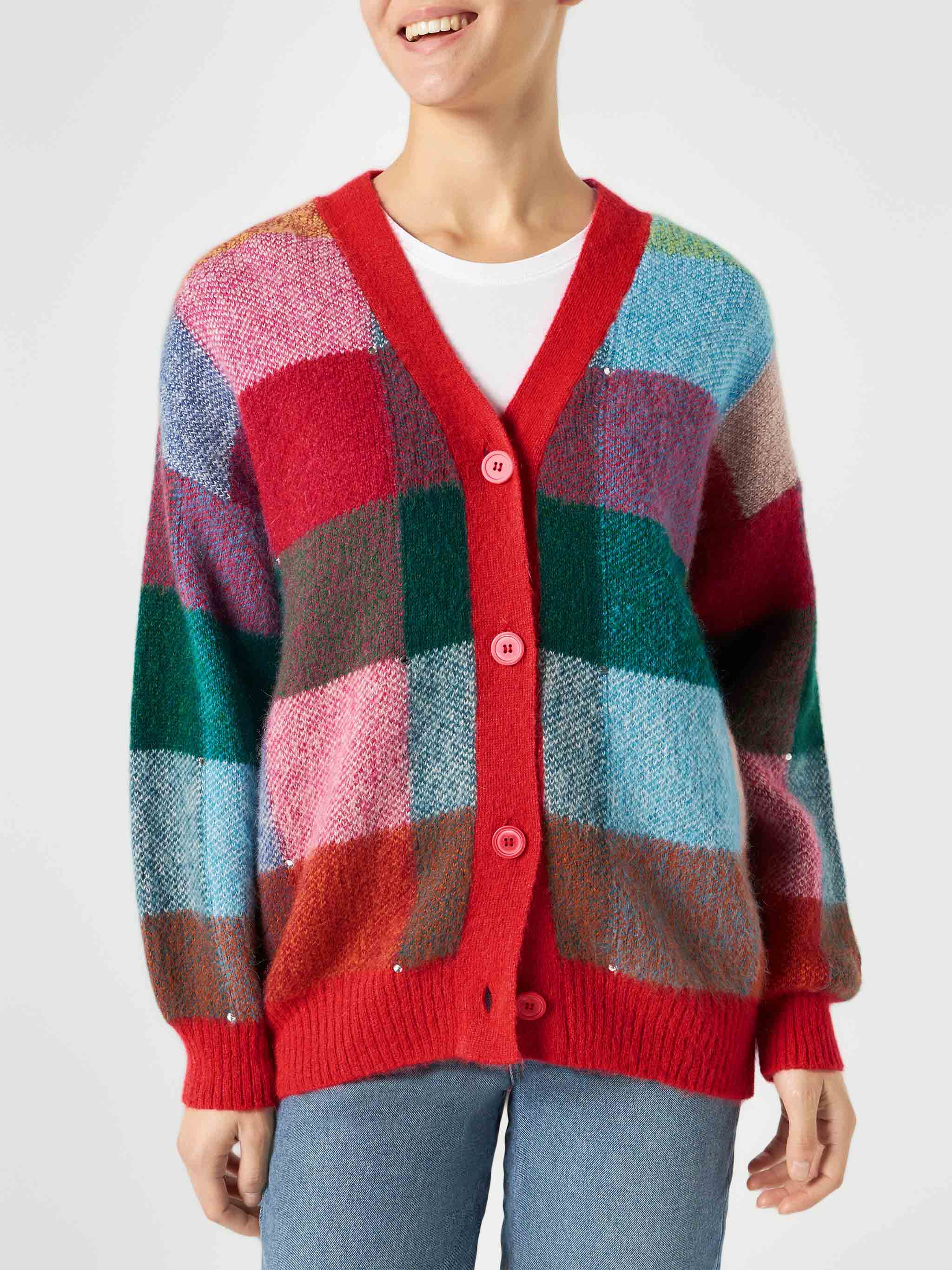 Damesvest in meerdere kleuren, geborsteld en versierd met strass-steentjes.