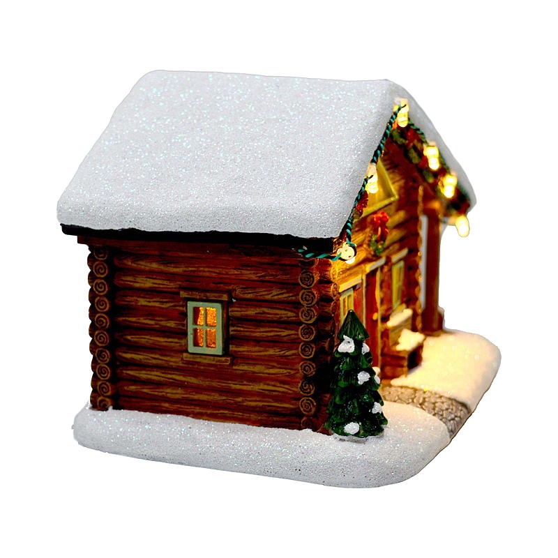 Kerstdorpje met huisje en verlichting