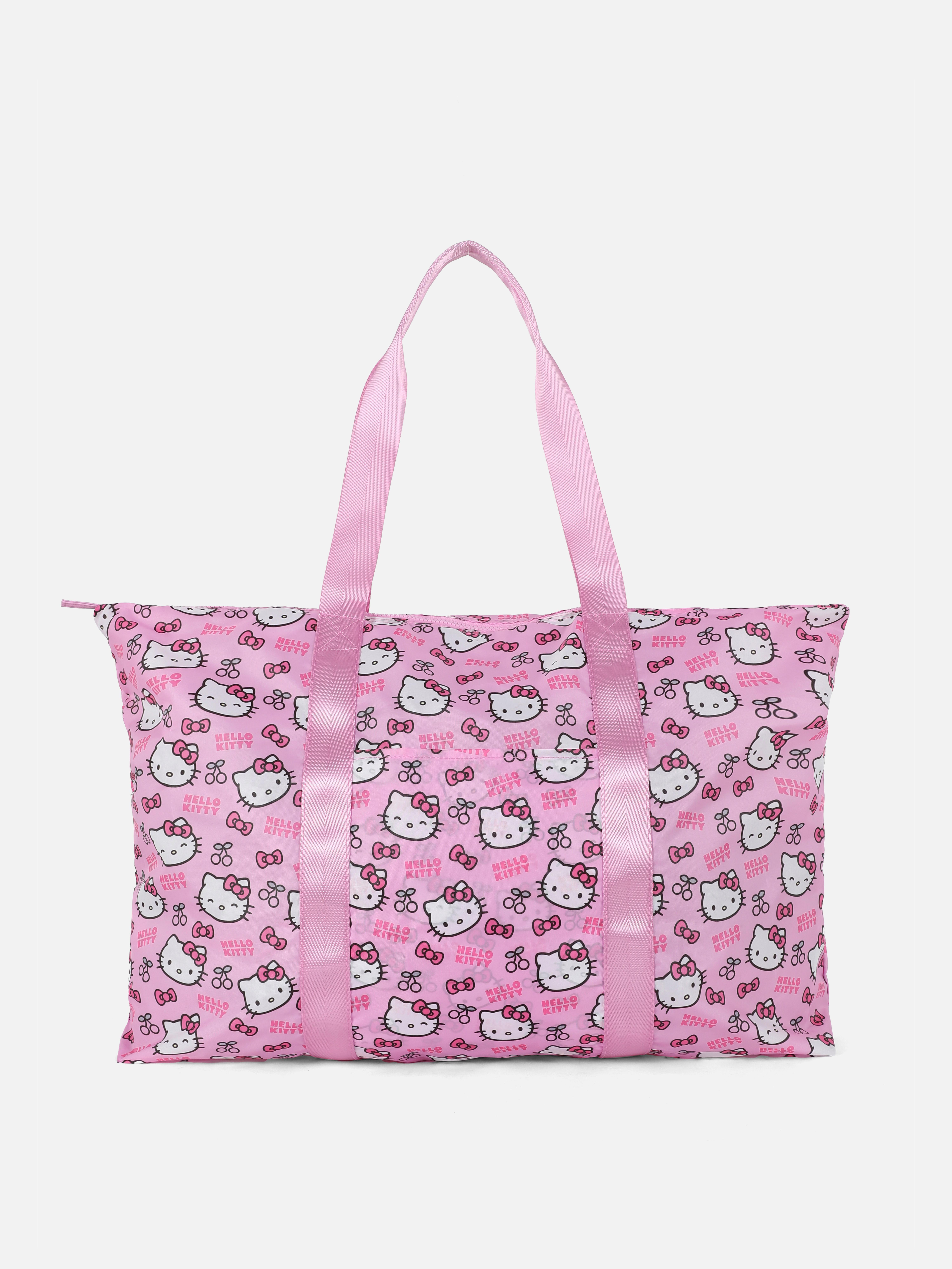 Geantă de călătorie pliabilă Hello Kitty Geanta noastră de călătorie pliabilă Hello Kitty cu bretele țesute este ideală pentru călătorii scurte