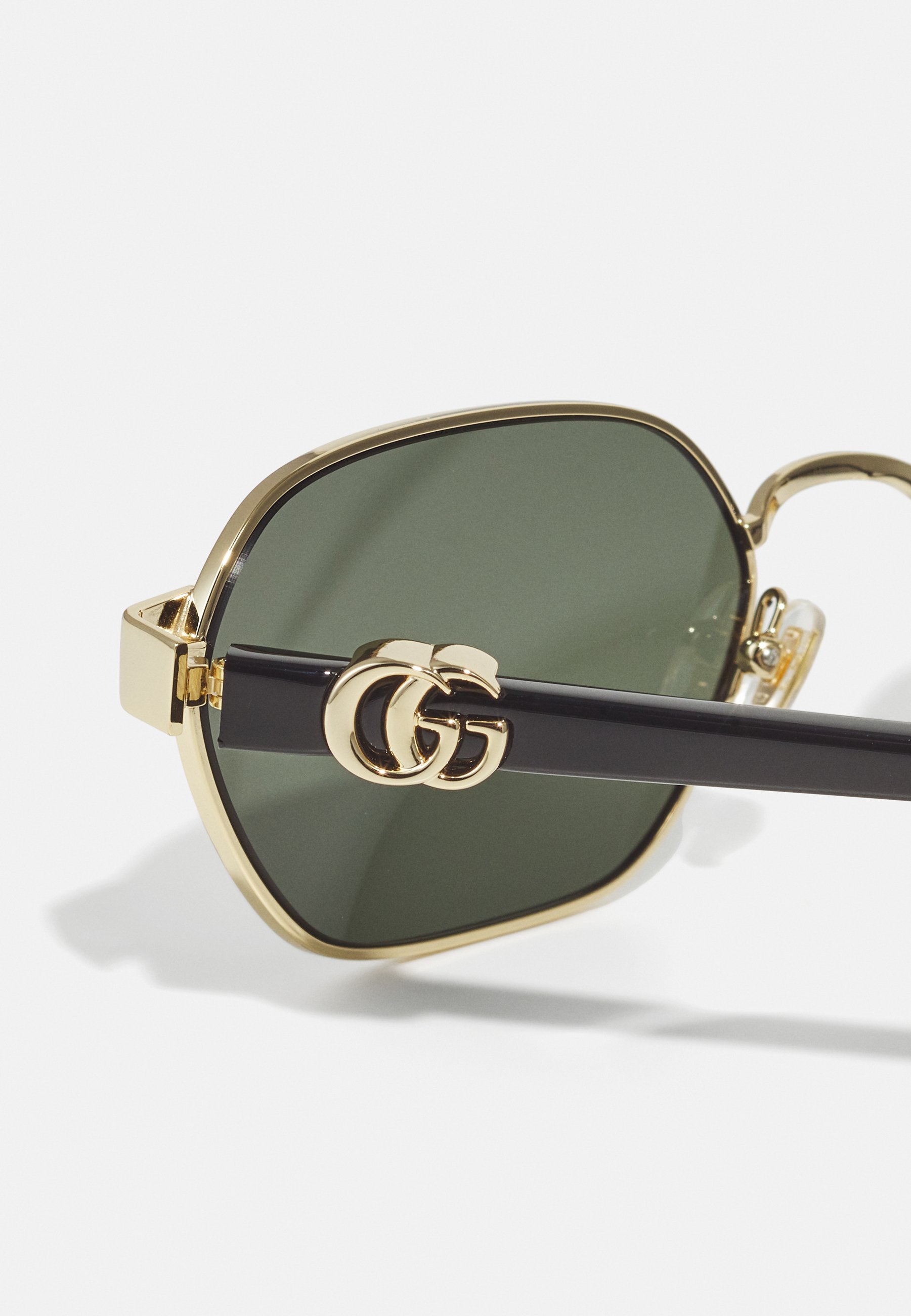 Lunettes de soleil Gucci unisexes - dorées/noires/grises