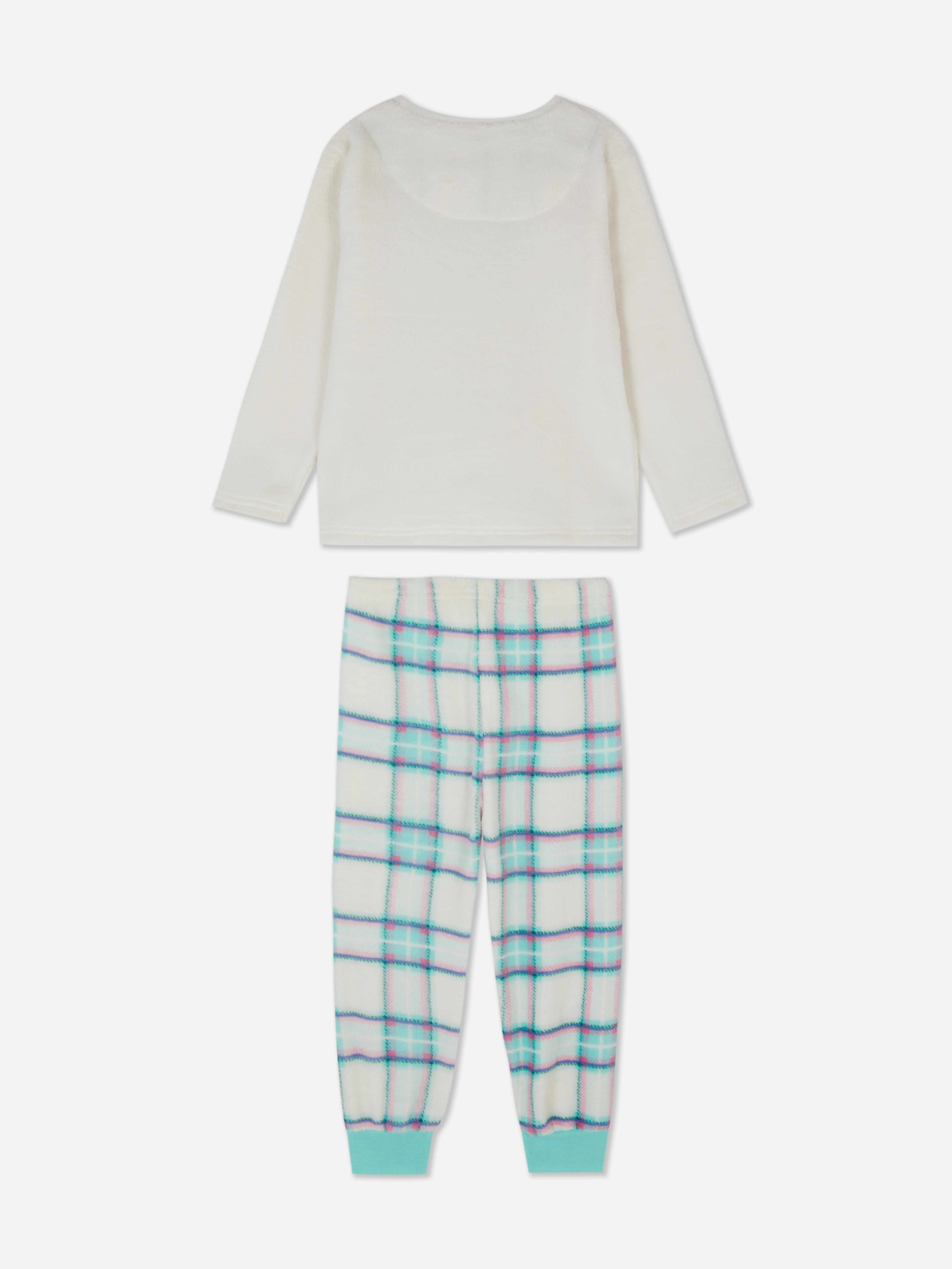 Ballerina-Pyjama aus Fleece Dieser Fleece-Pyjama im Ballerina-Design besteht aus einem langärmeligen Oberteil und einer langen Hose mit Bündchen.