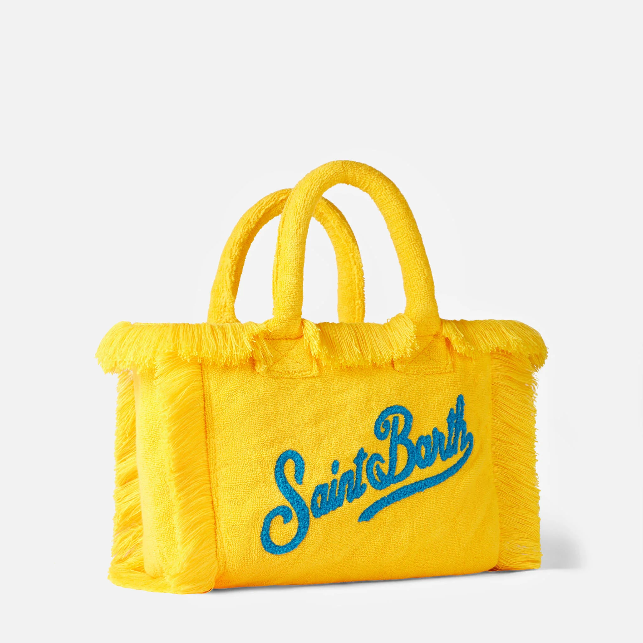 Colette gul frottéhåndtaske med frynser, blåt Saint Barth-præget logo, metallynlåsflap og inderlomme | MC2 Saint Barth