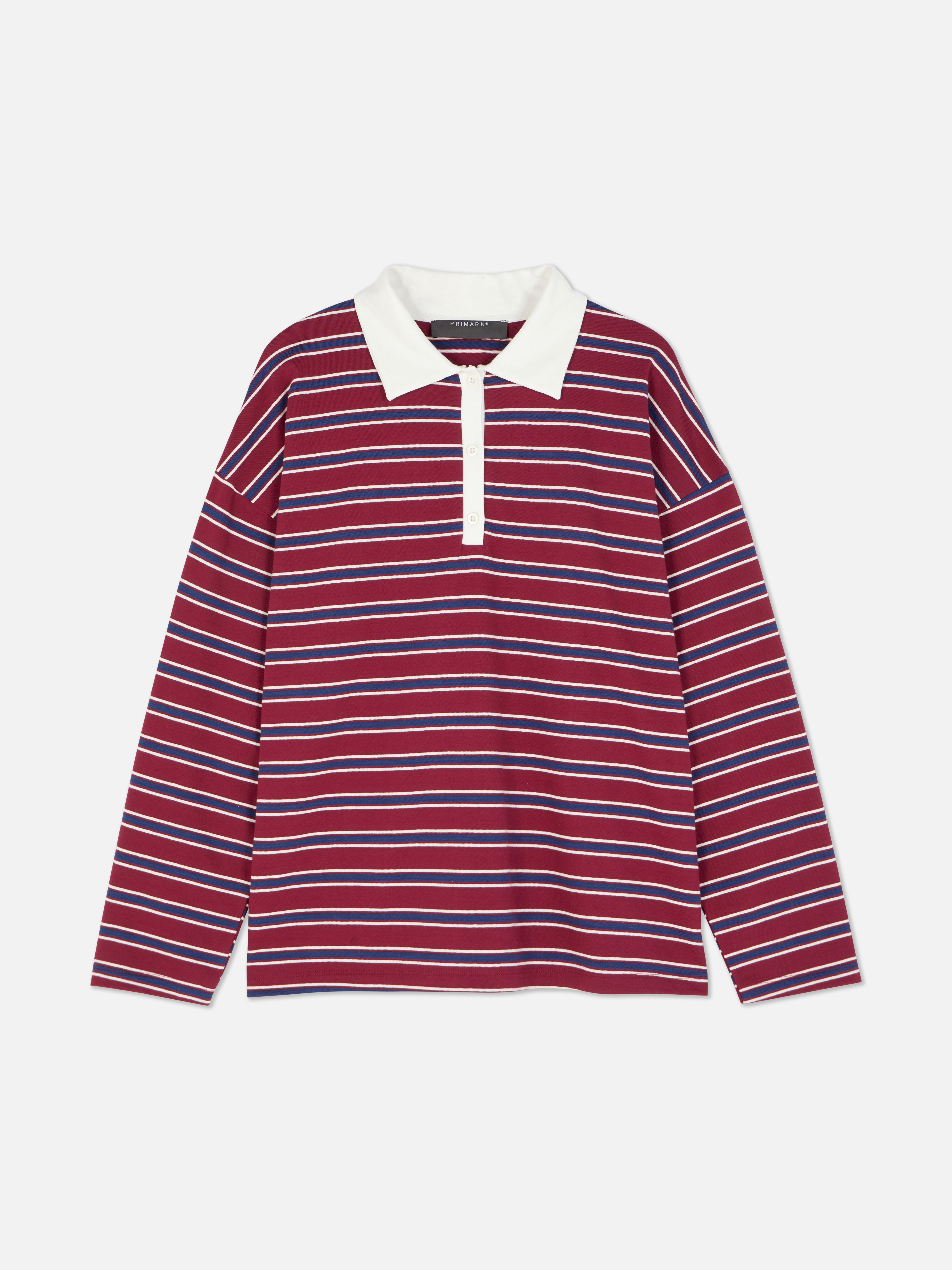 Tricou polo cu mânecă lungă. Acest polo are guler clasic, închidere cu jumătate de nasture și mâneci lungi.