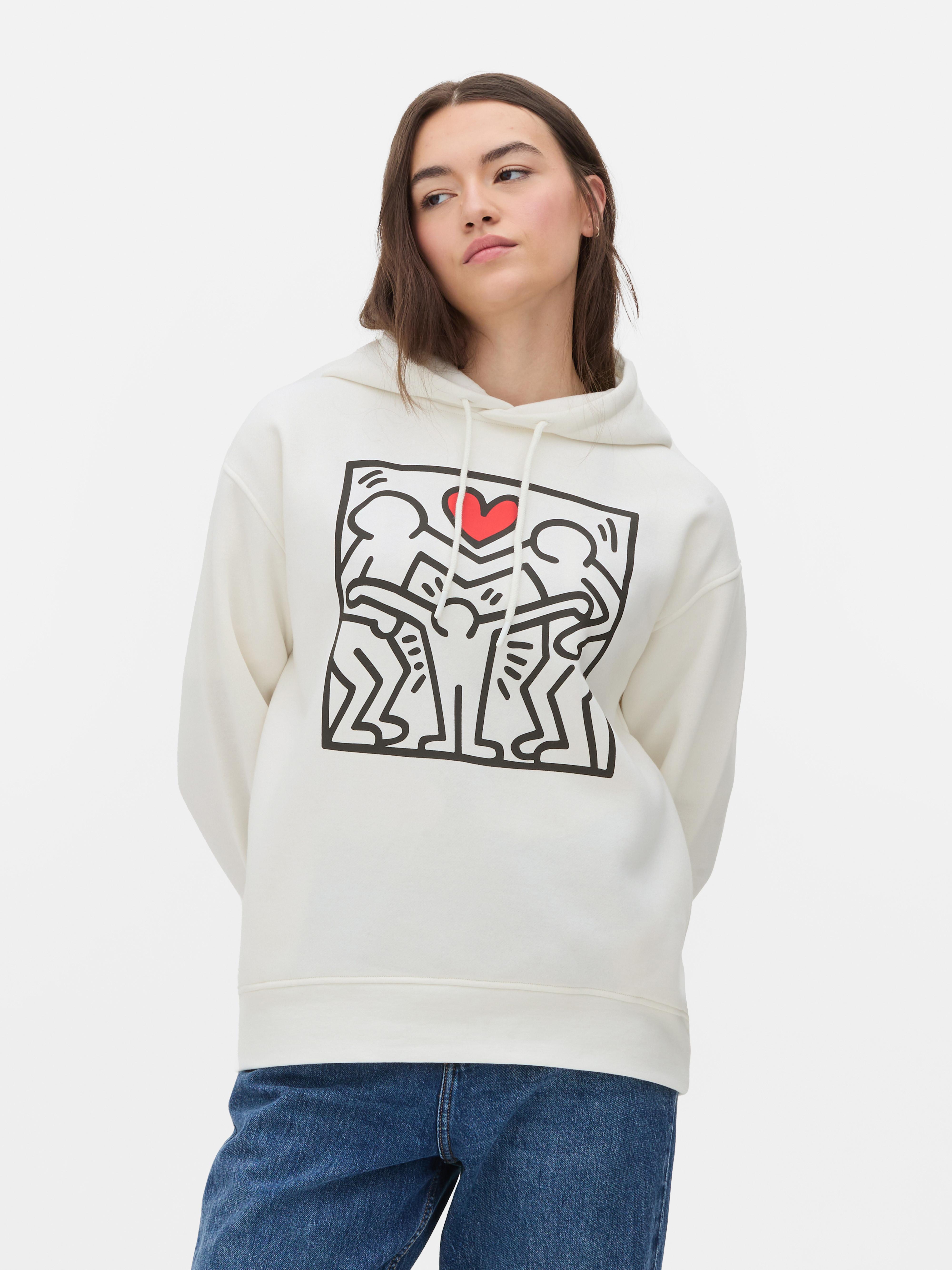 Hanorac cu imprimeu Keith Haring Un hanorac cu șnur de strângere și un imprimeu Haring impresionant