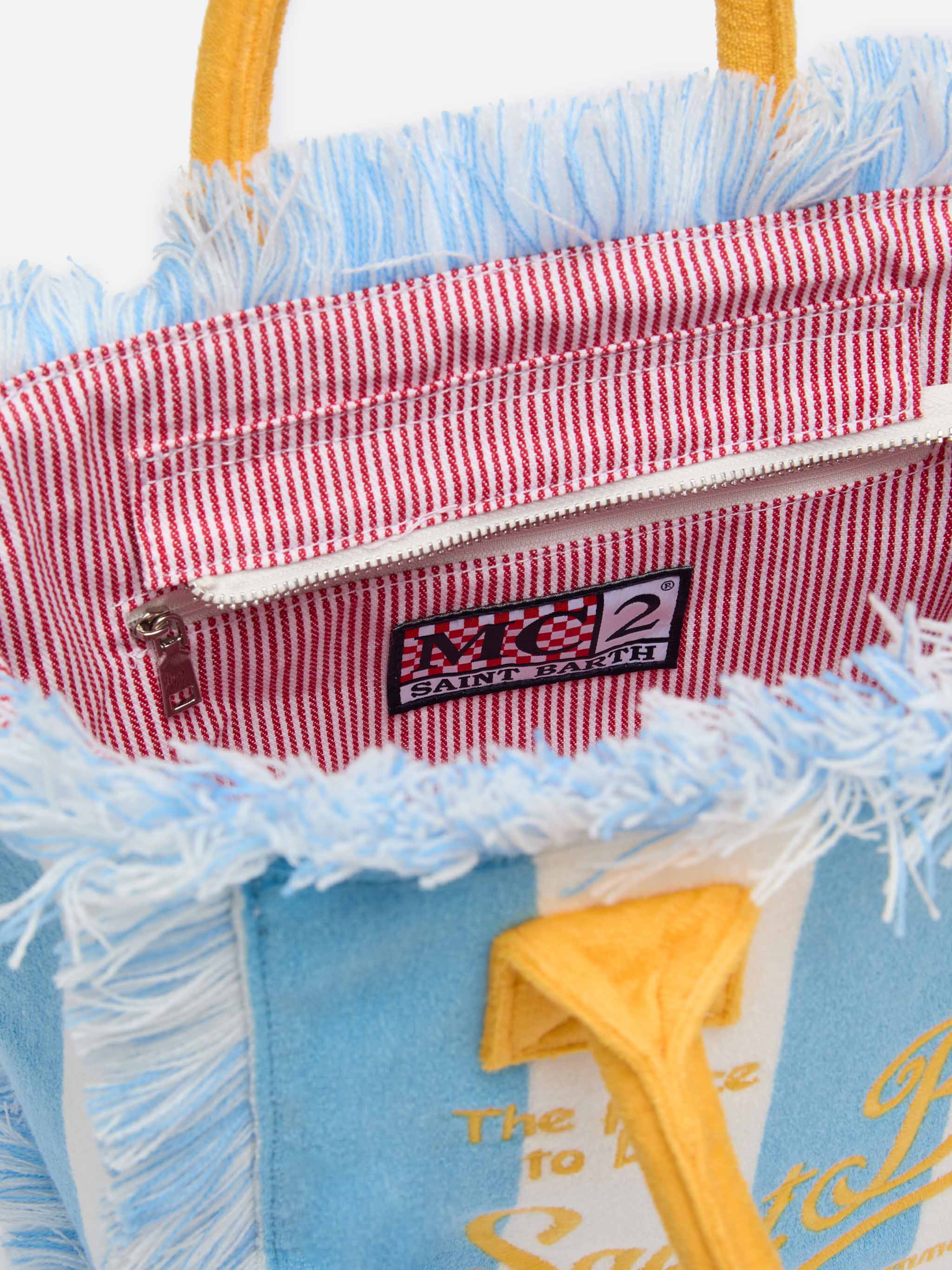Colette tas van blauwe sponsstof met blauwe streepprint.