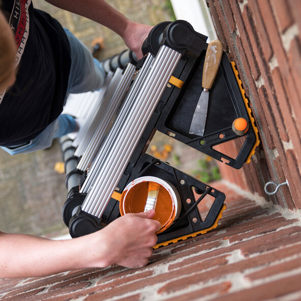 Spacers for telescopic ladders
