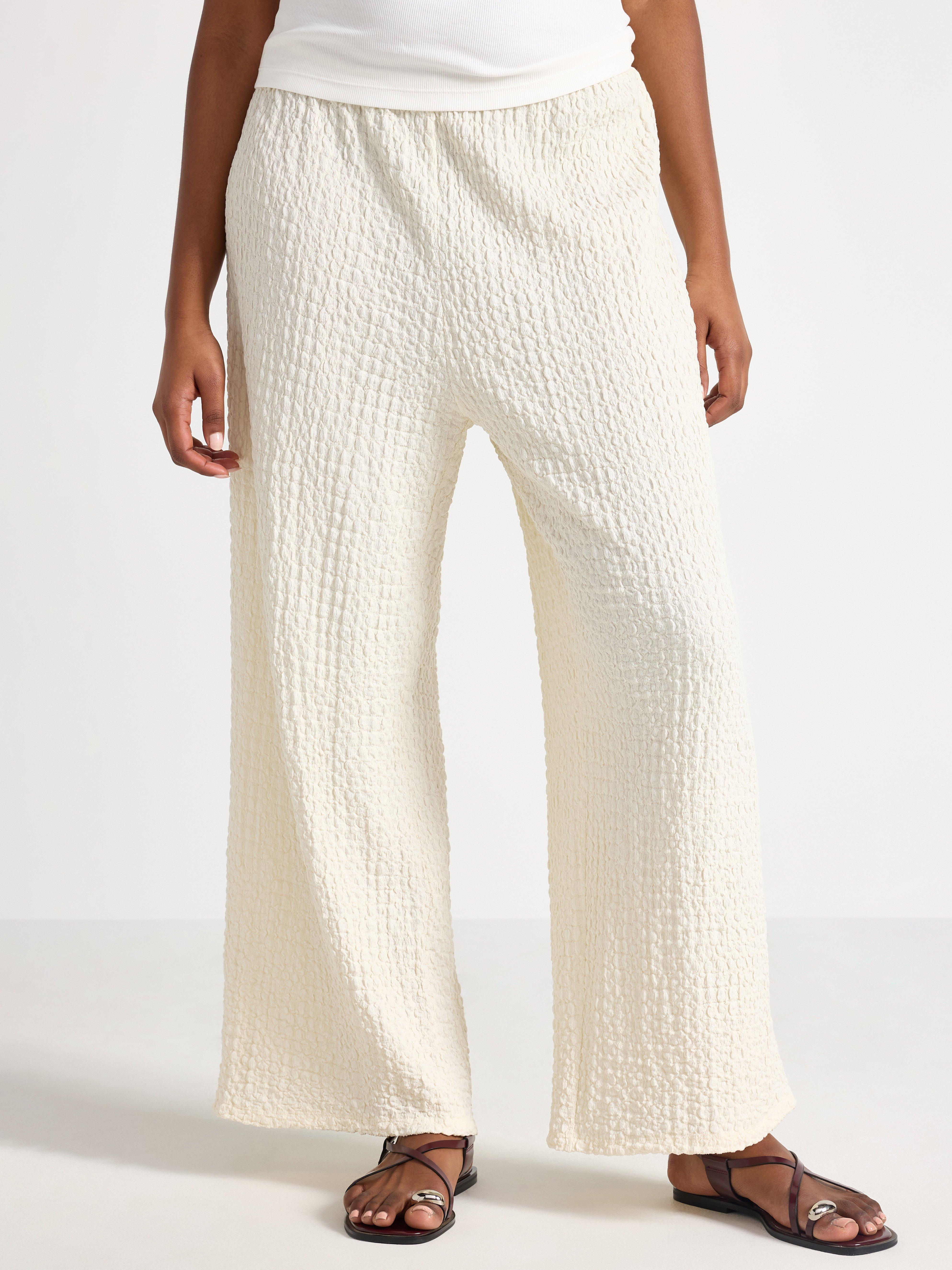 Pantalones de punto texturizado color blanco roto