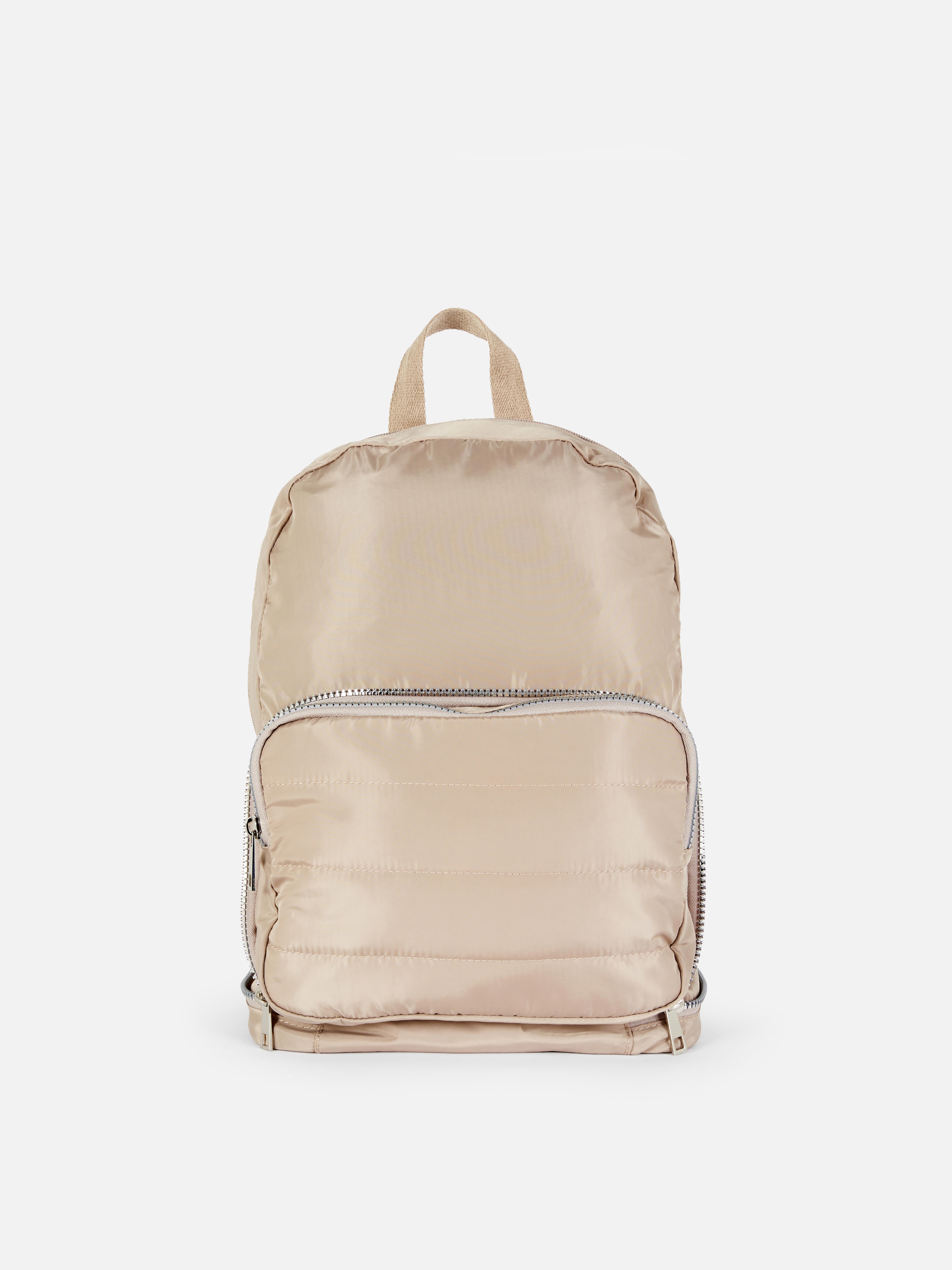 Geantă căptușită două într-unul. Un rucsac și o geantă crossbody într-o singură geantă elegantă.