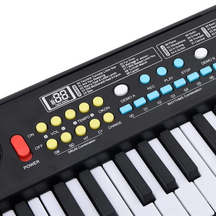 Teclado de piano eléctrico de 37 teclas y micrófono infantil.