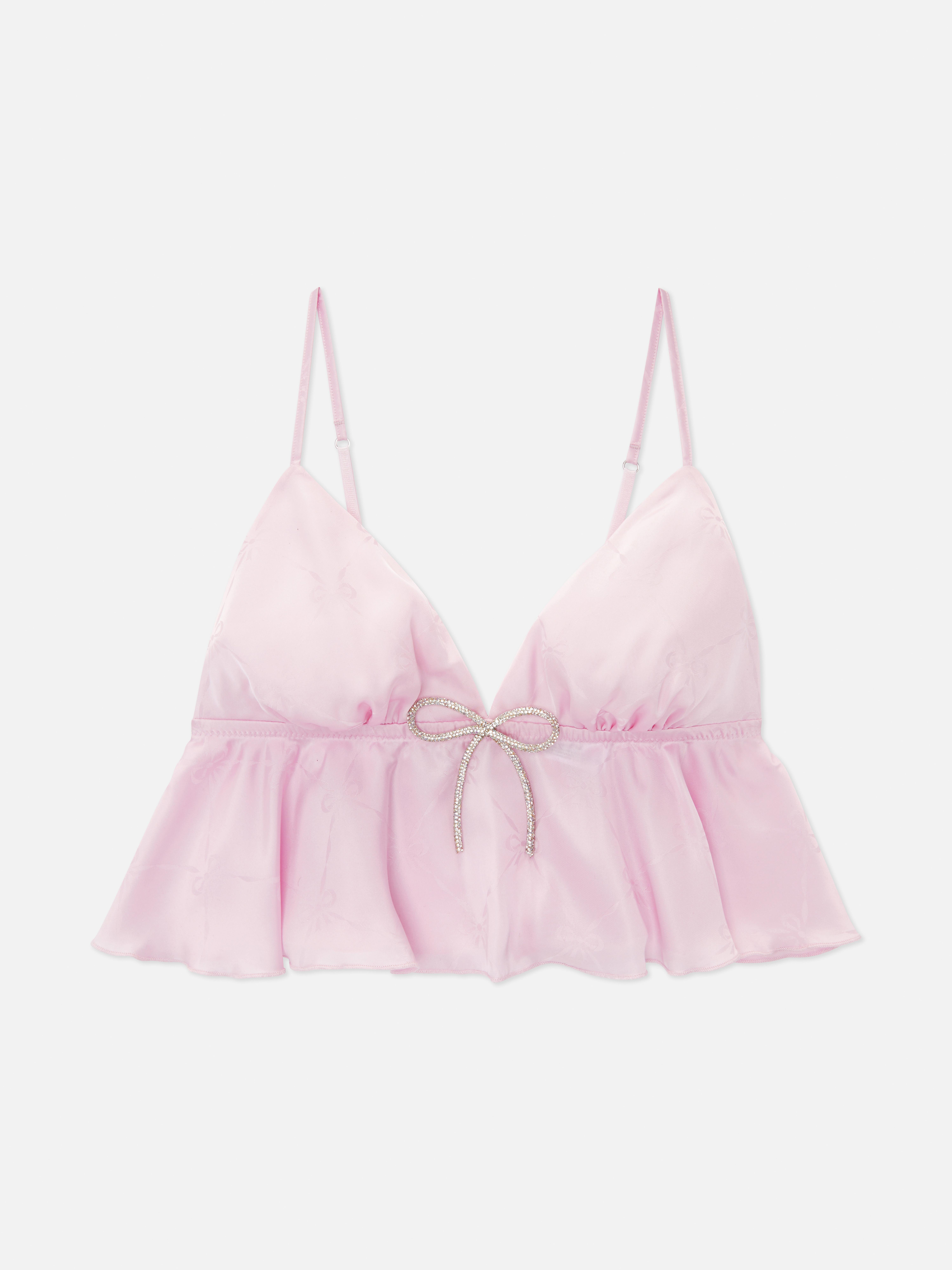 Top sutien cu fundă și strasuri. Un top sutien vaporos cu bretele reglabile și fundă cu strasuri.