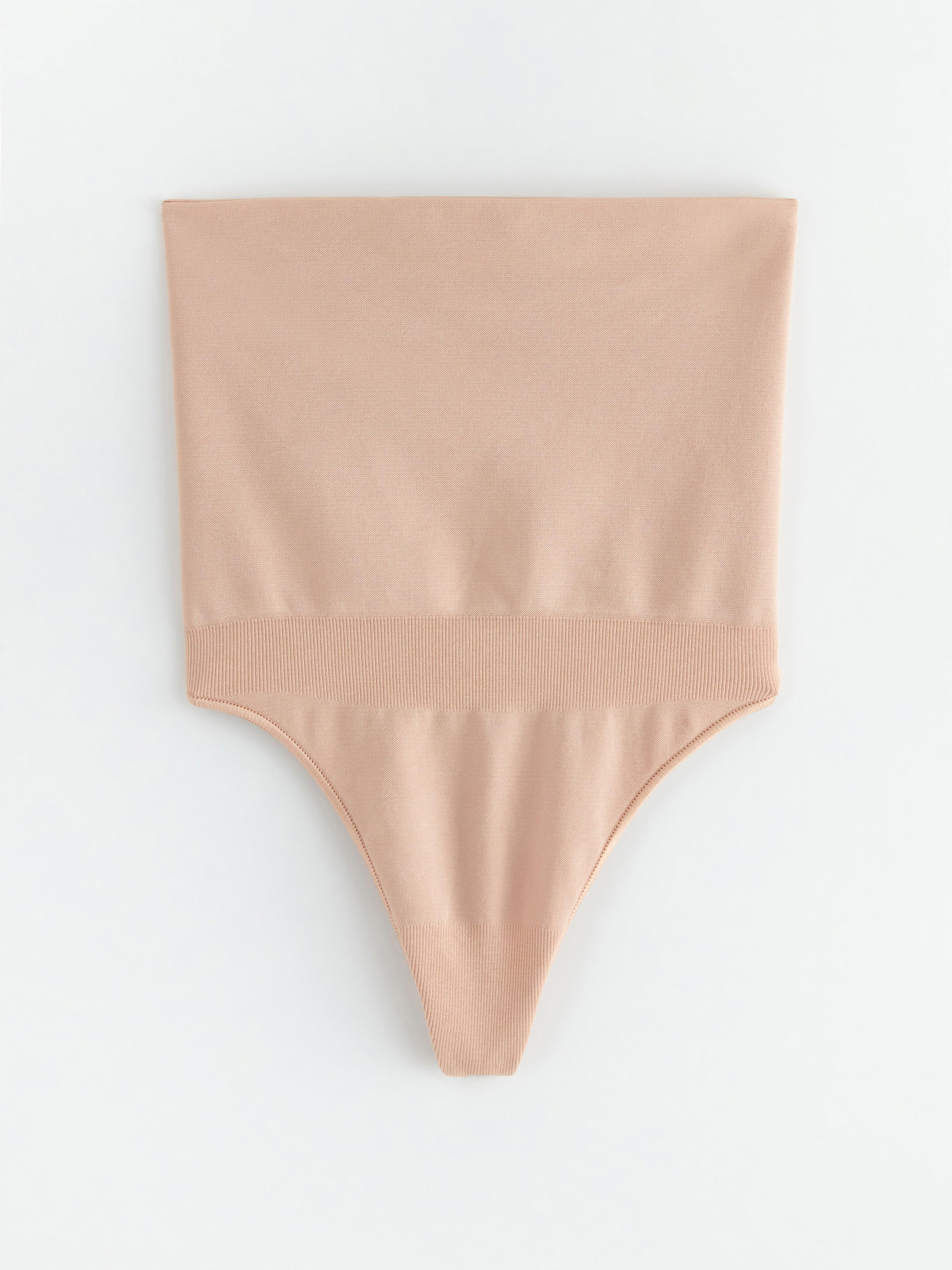 String gainant à maintien zonal beige