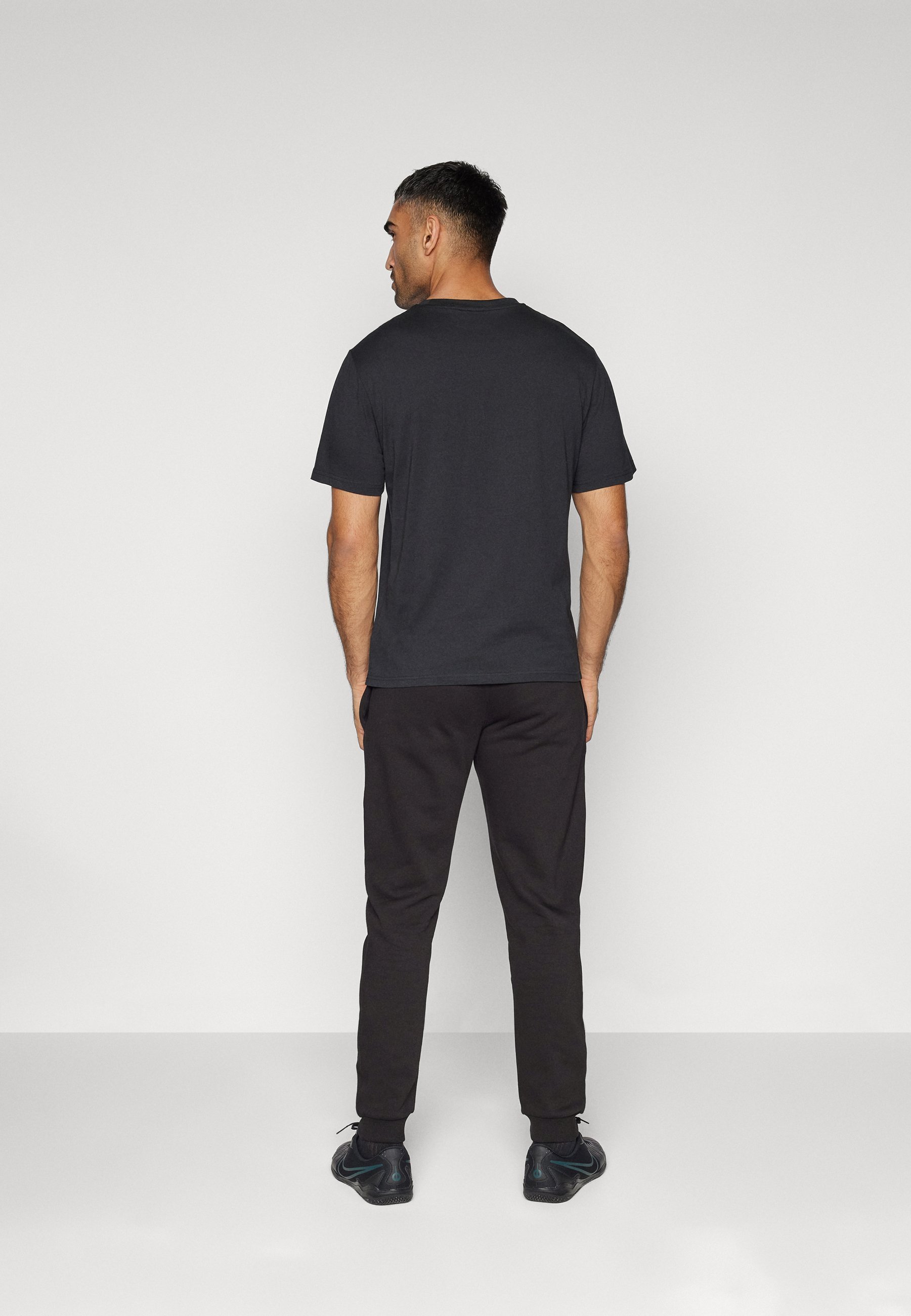 Umbro TEAM SKINNY JOG PANT - Trainingsbroek - zwart/wit
