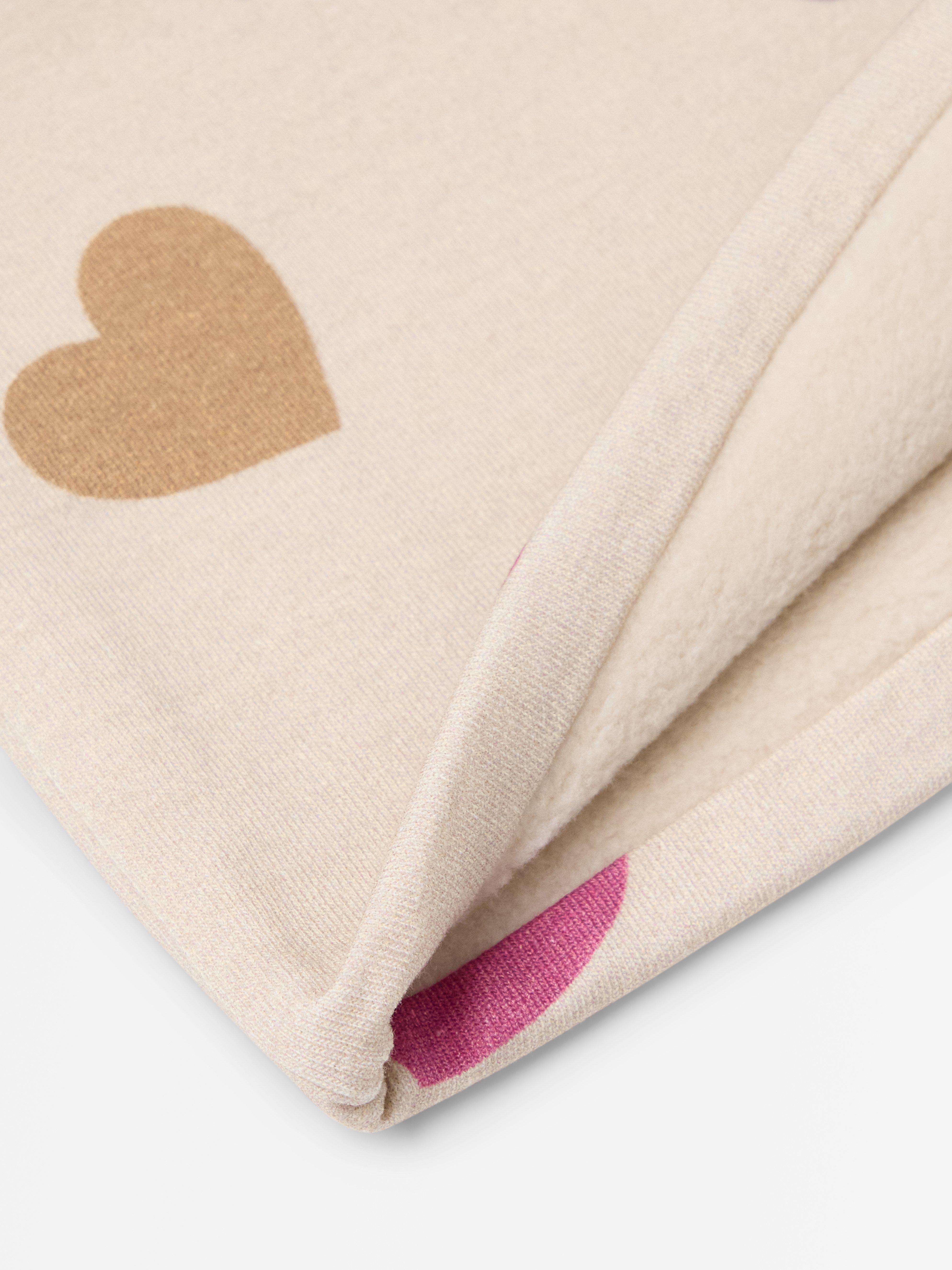Lue med fôr Lys beige